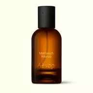 Amber glass Aesop Marrakech Intense Eau de Parfum bottle with black cap on a white background.