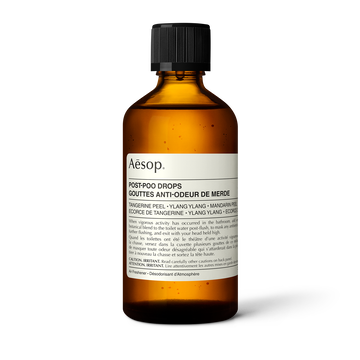 Front of an Aesop Post-Poo Drops amber bottle.