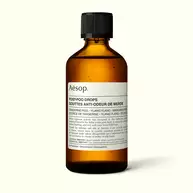 Front of an Aesop Post-Poo Drops amber bottle.