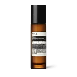 Solais Replenishing Hand Serum in a glass bottle.
