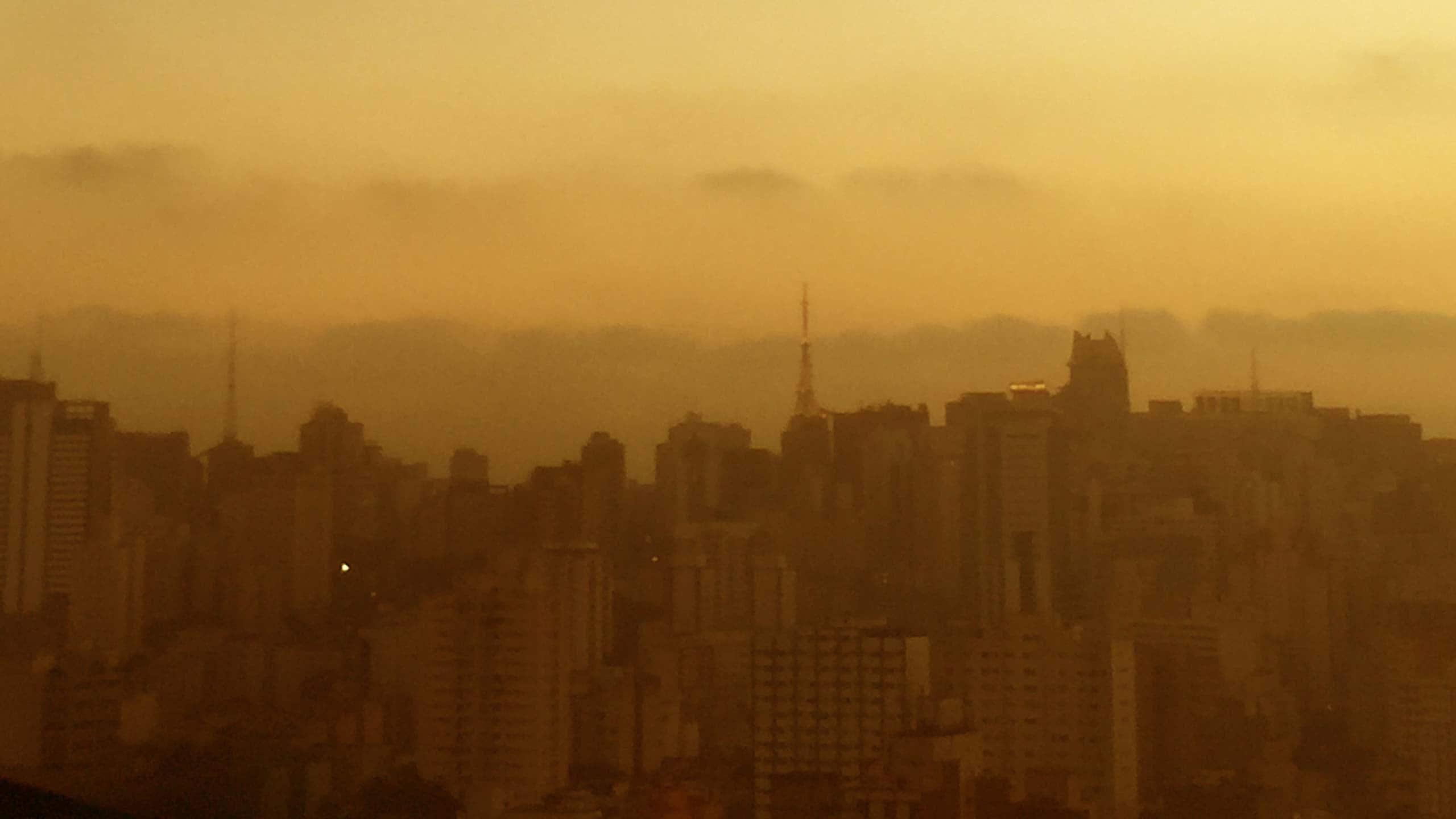 Photograph of a city skyline captured at dusk. 