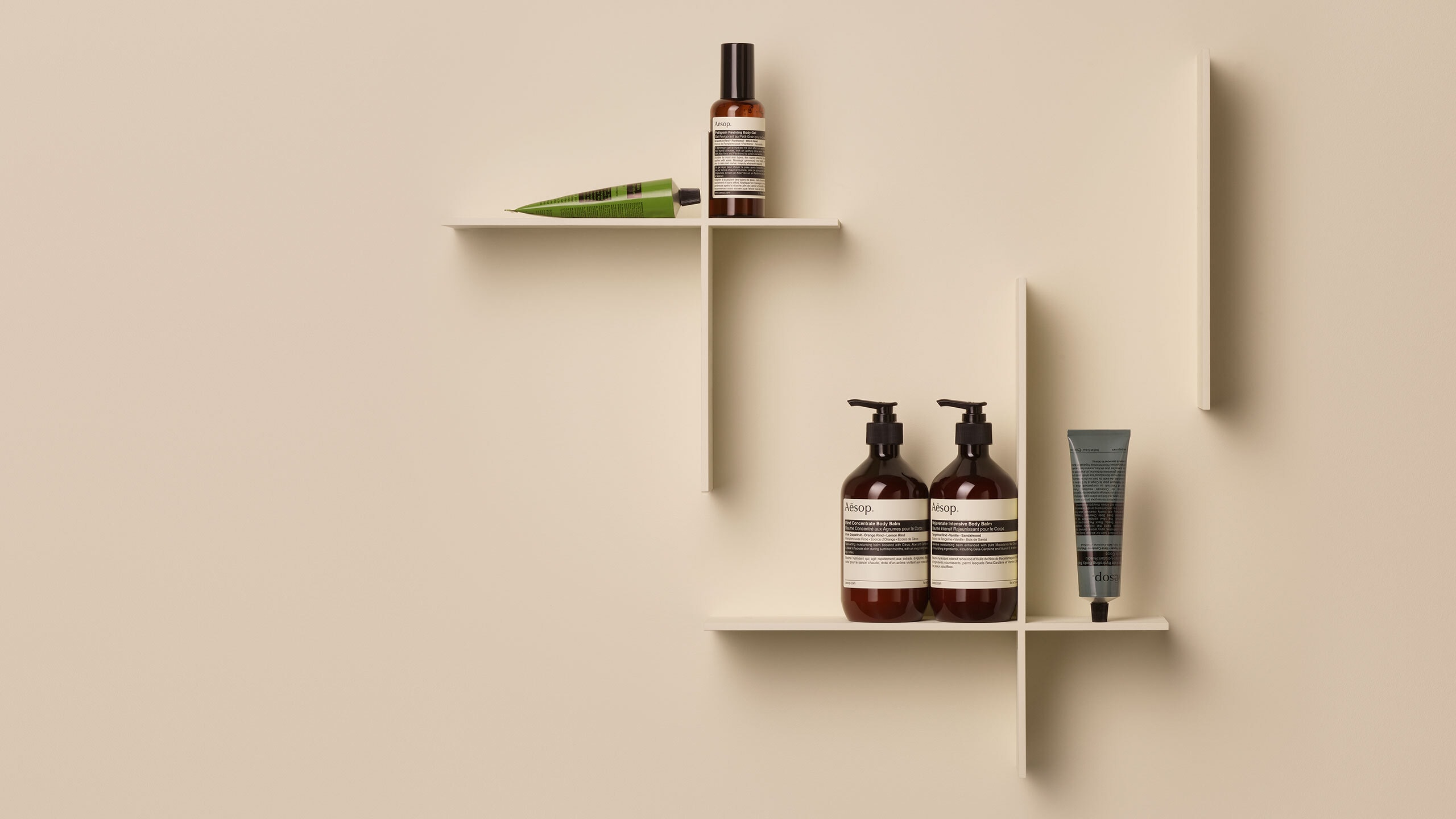A seletion of Aesop products with a beige background