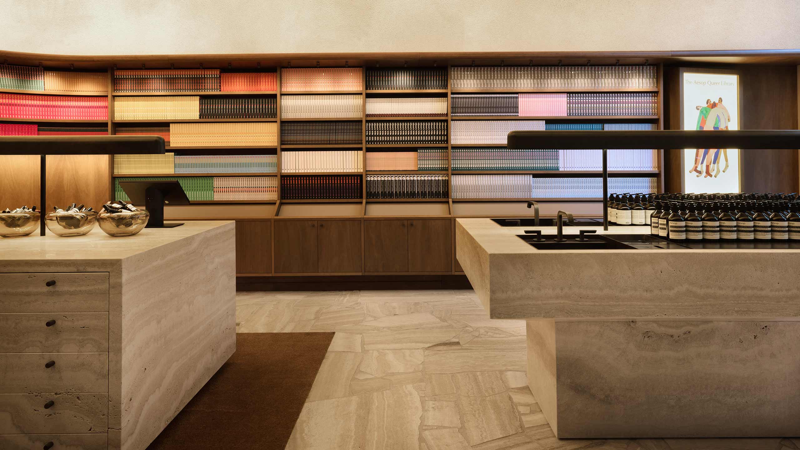 Aesop Collins Street store interior displaying books neatly stacked on the shelves. 