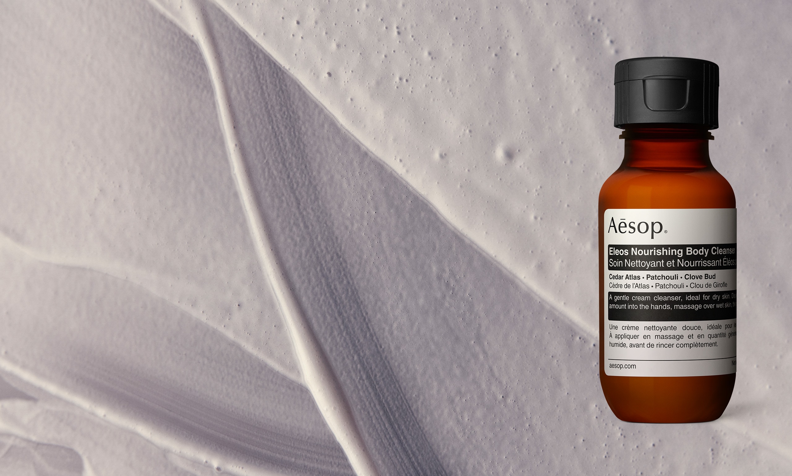 Eleos nourishing body cleanser texture overlay with Eleos nourishing body cleanser deluxe sample