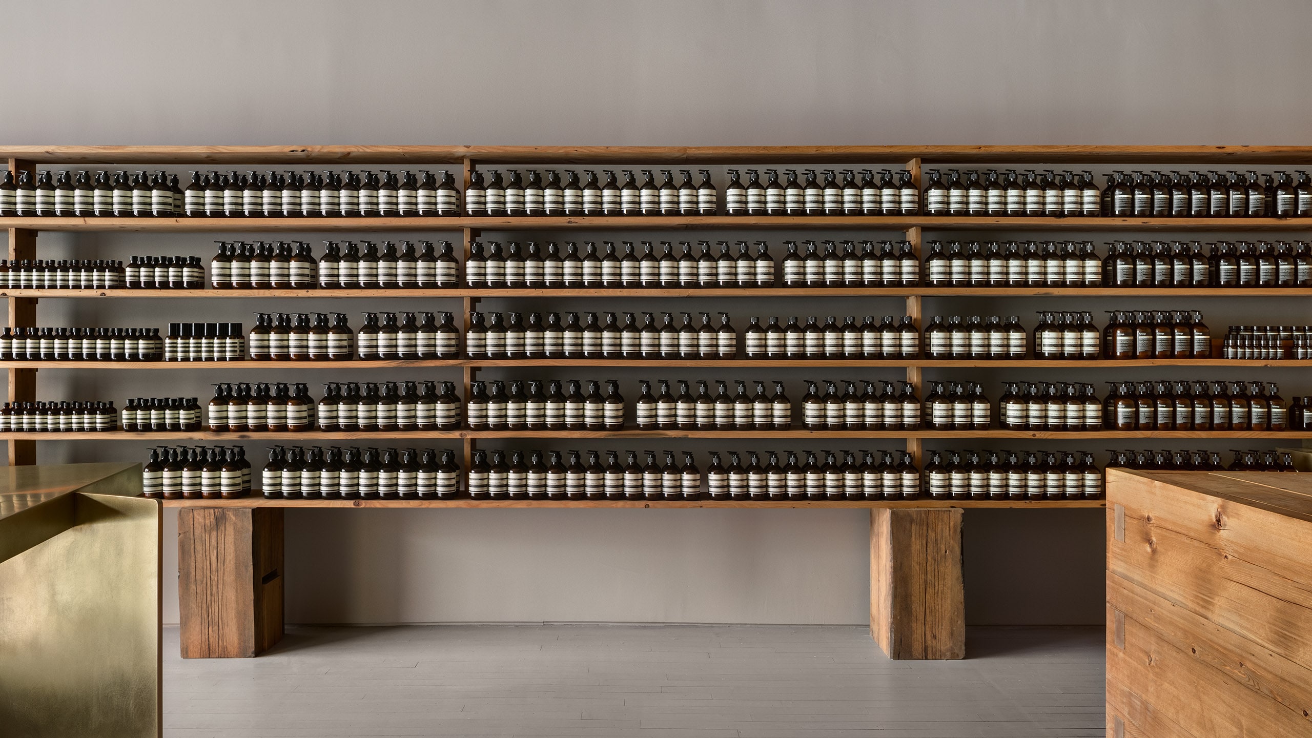 Aesop Greenwich Connecticut Store Interior, featuring a full wall of brown bottles.