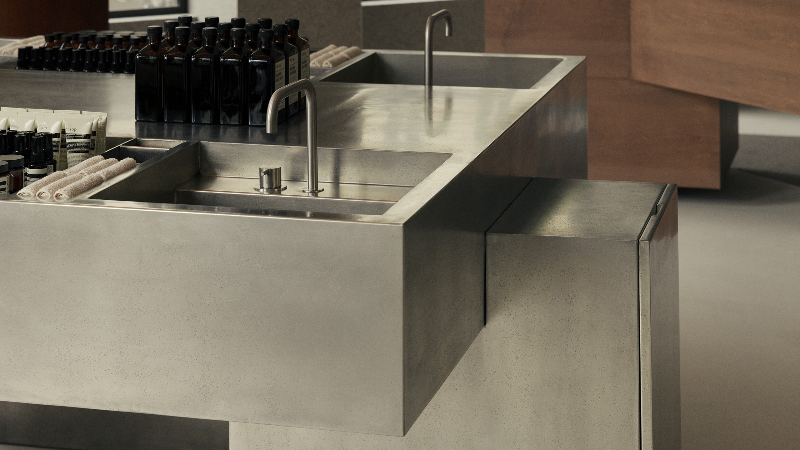 Aesop Lyon Place de la Republique store interior main metal basin close-up.