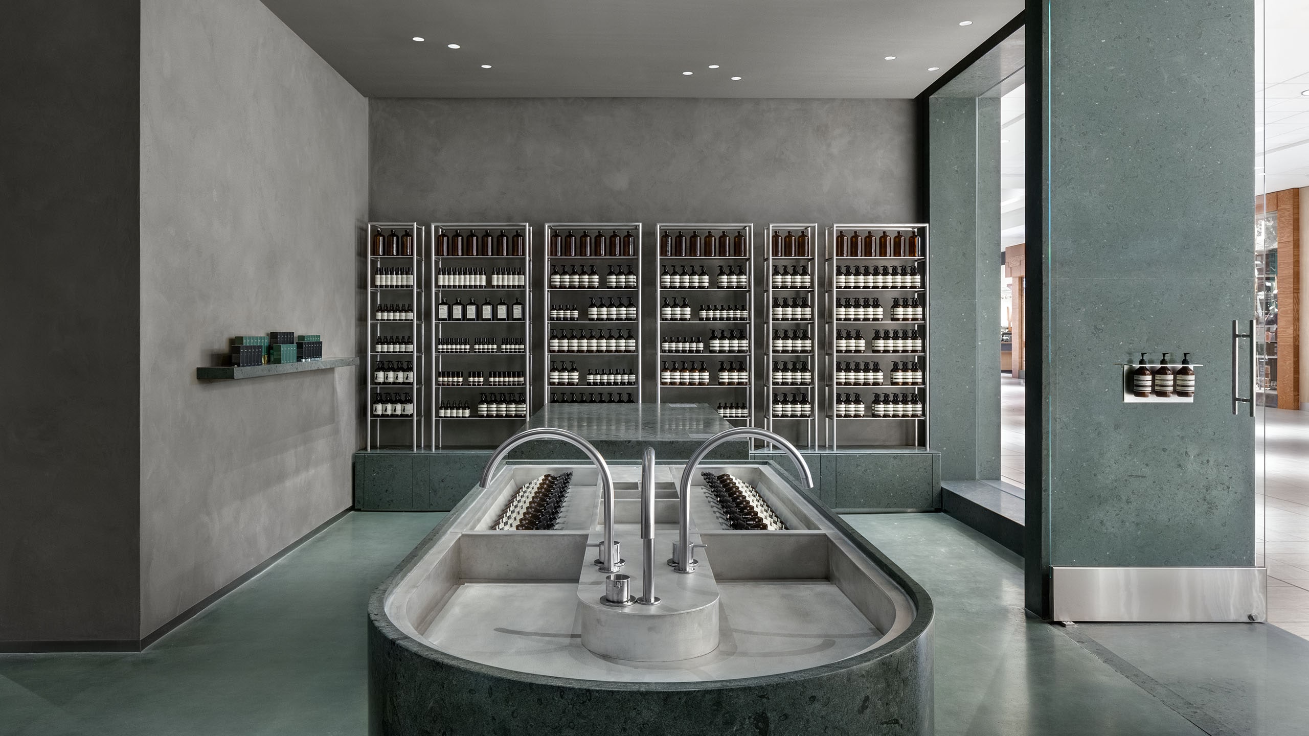 A top-down view of the basin, featuring large metallic taps.