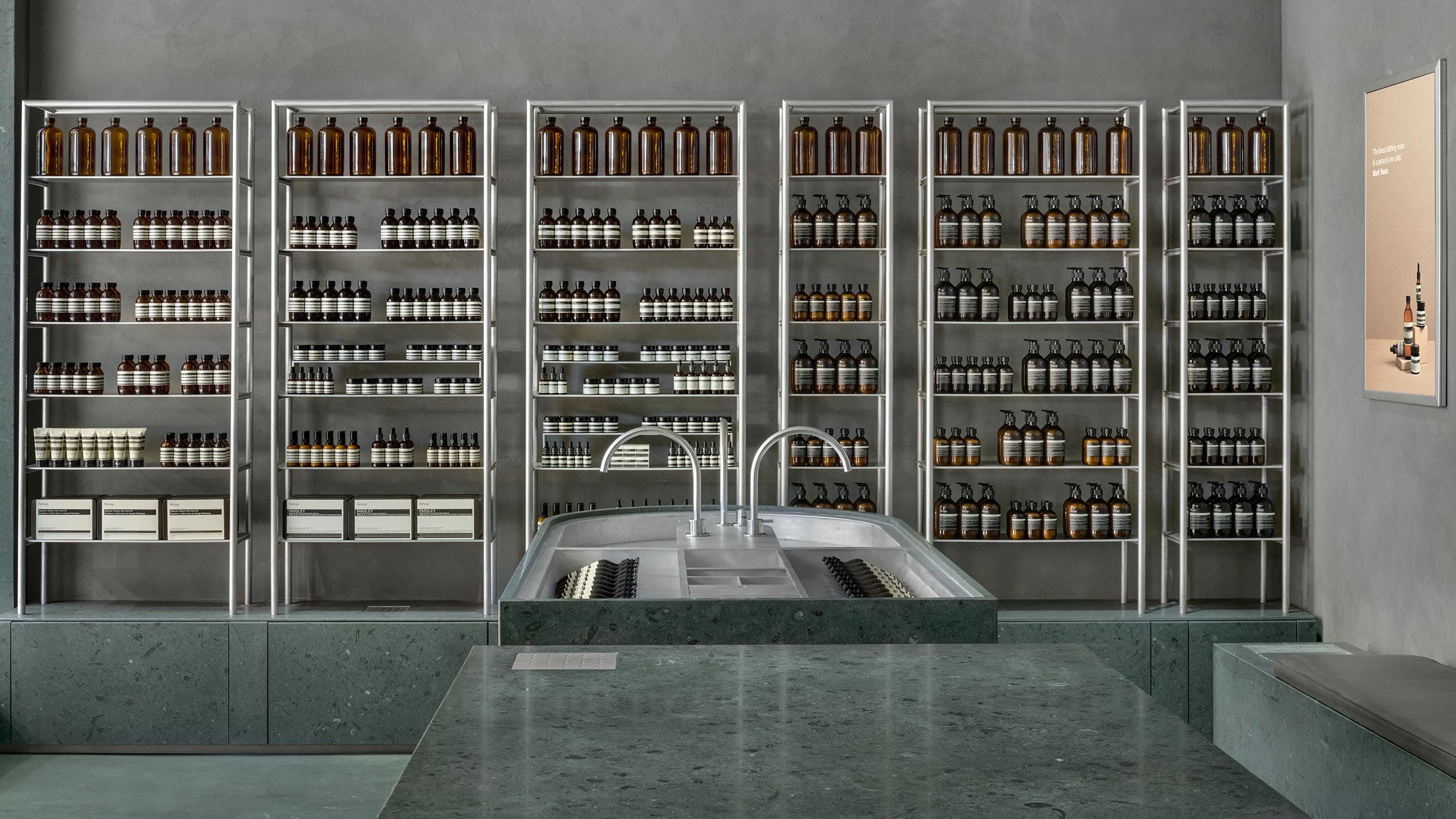 The limestone counter in the foreground, followed by the basin area, and wall of products in the background.