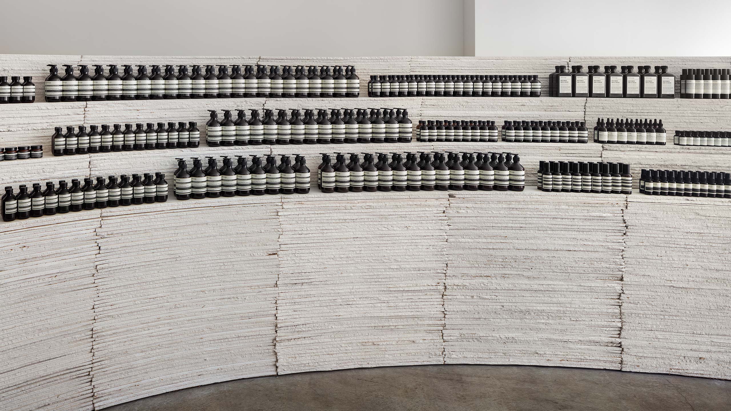Aesop Berkeley store interior, featuring rounded product cabinetry made of drywall