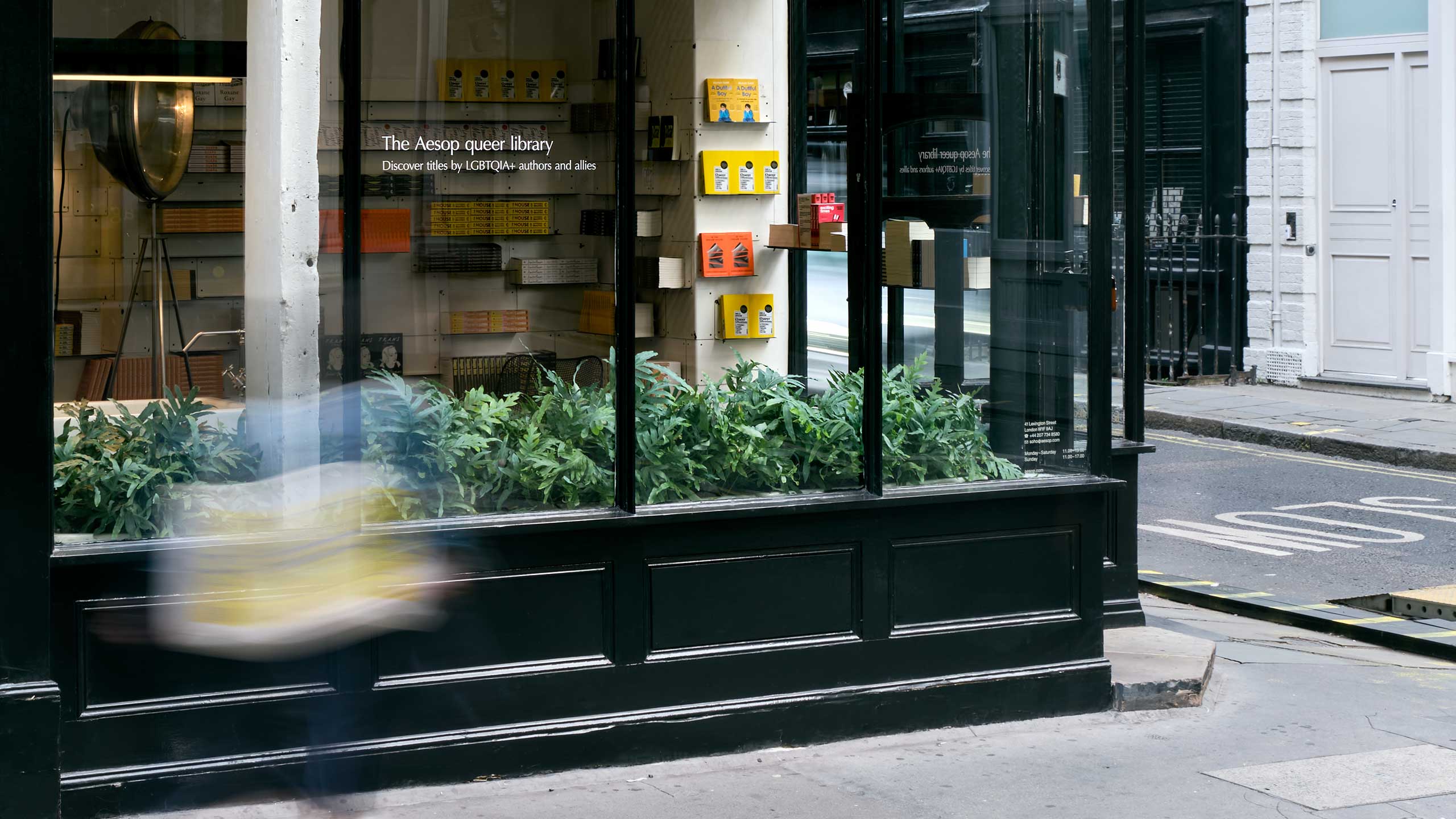 Aesop Soho store displaying a range of books in window