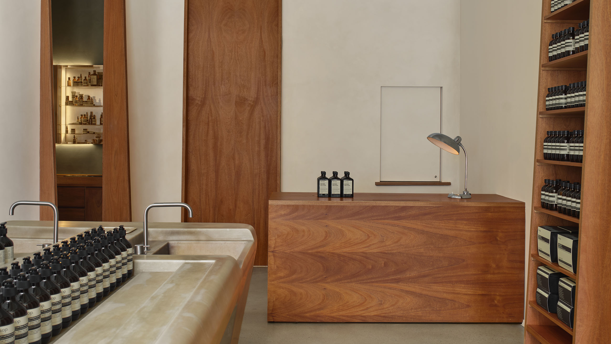 store interior shot featuring marble basin unit and wooden checkout counter
