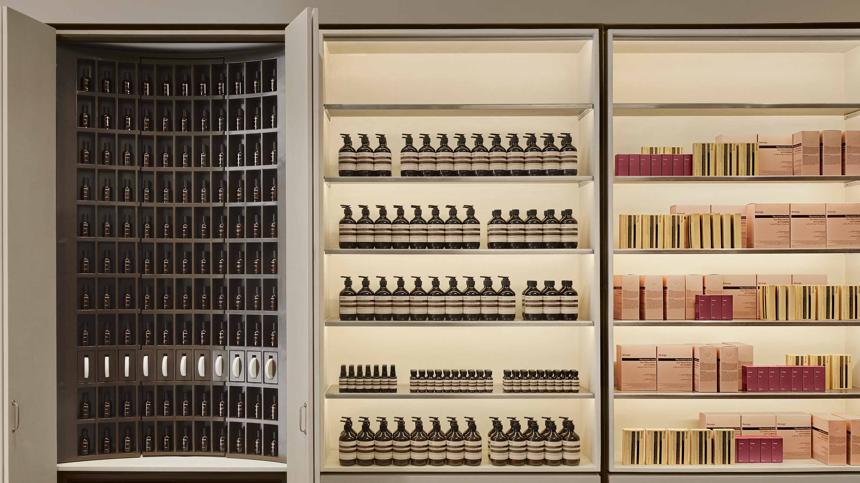 Aesop Valley Fair fragrance armoire featuring rows of fragrance and body product