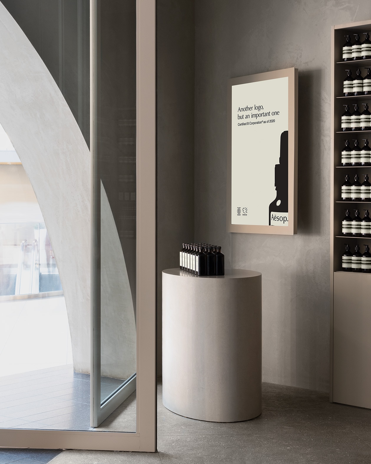 Aesop Eaton Toronto Store entrance with amber bottles on a plinth display