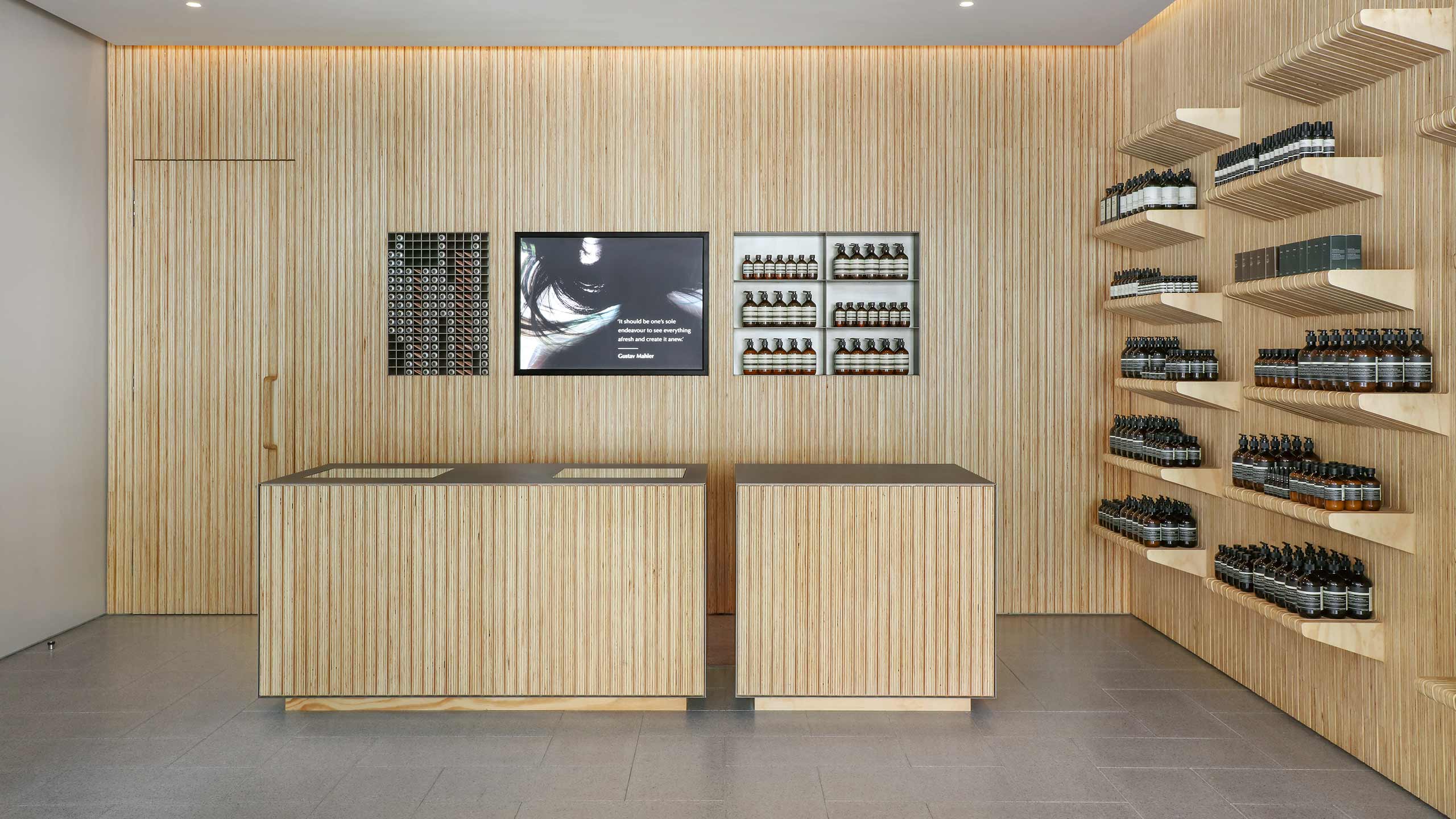 A wooden counter contrasted with a steel bench top. 