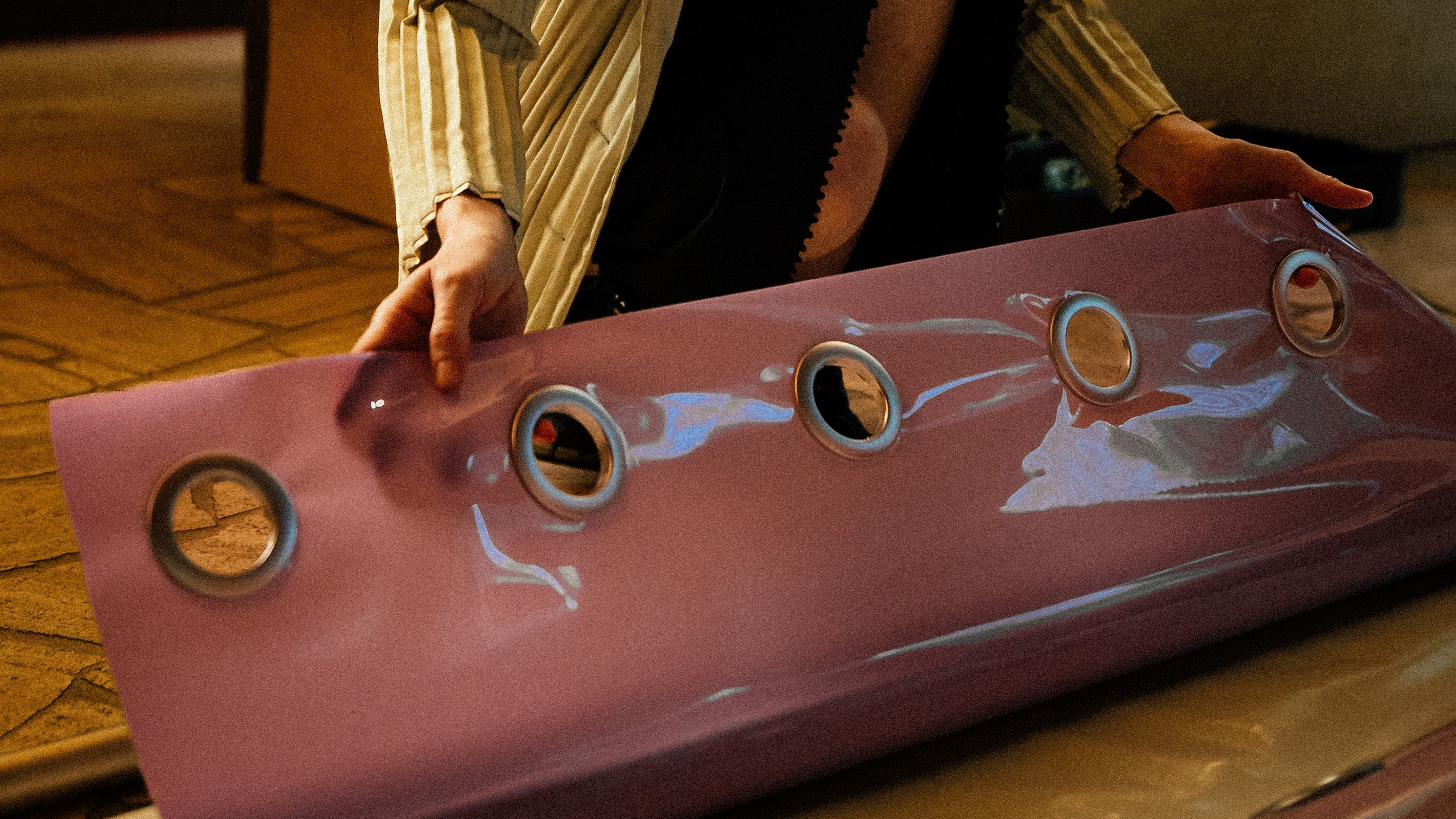 Jessie French holding a art display material