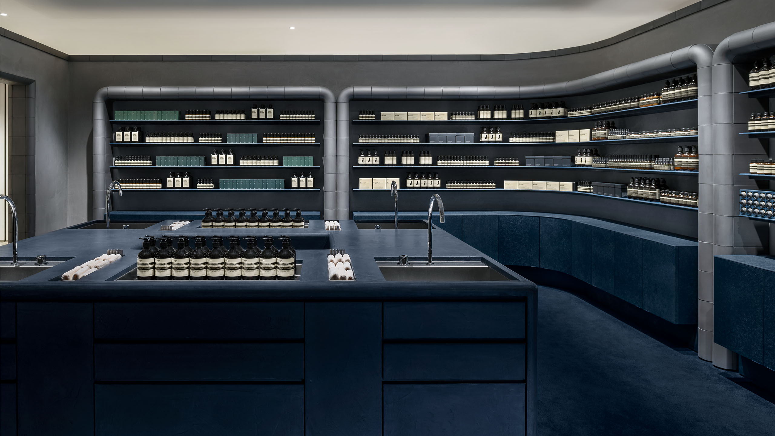 Aesop Kobe BAL store over view, including basin with dark navy colour atmosphere
