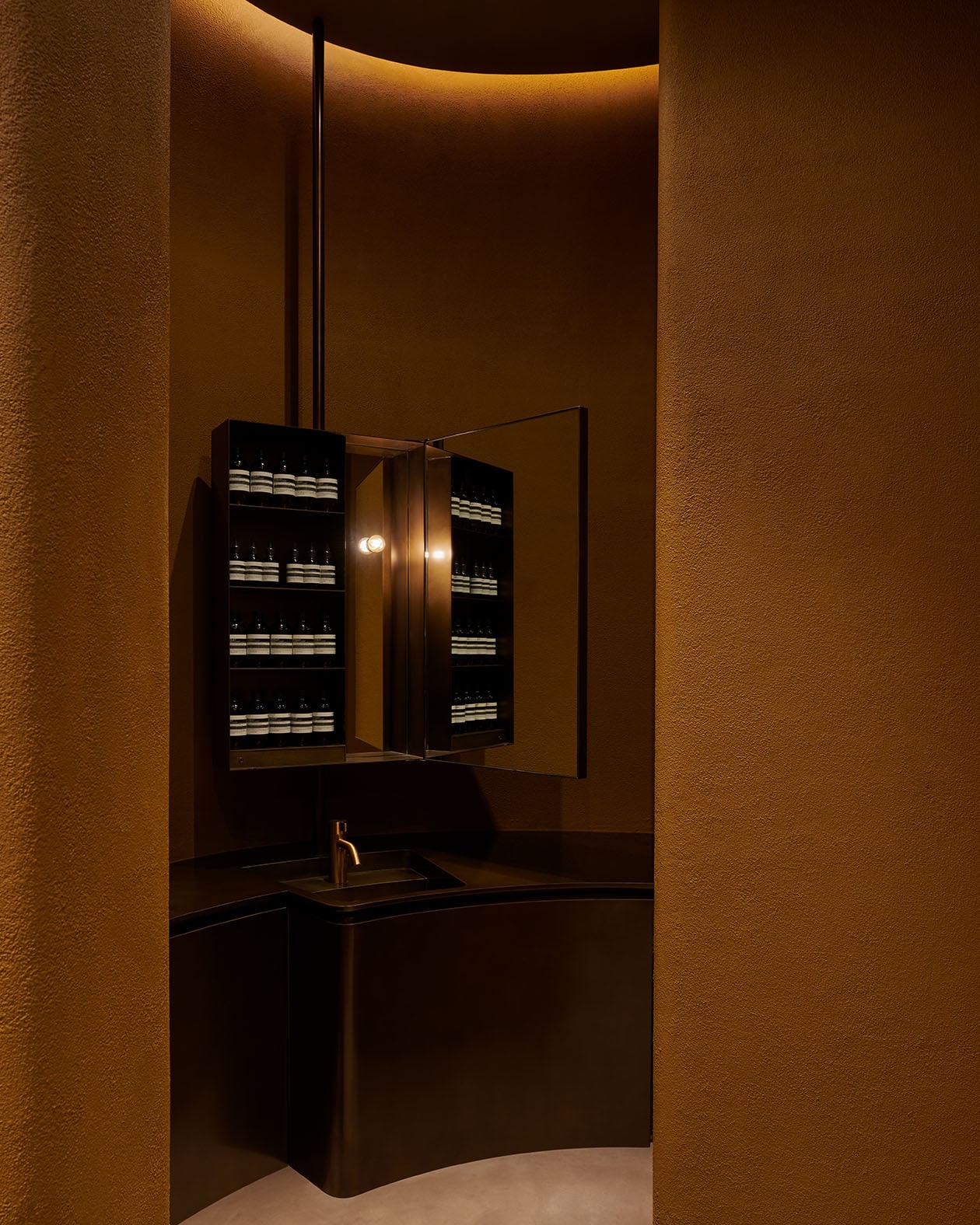 Recessed lighting on the shelves impart a tranquil glow. 