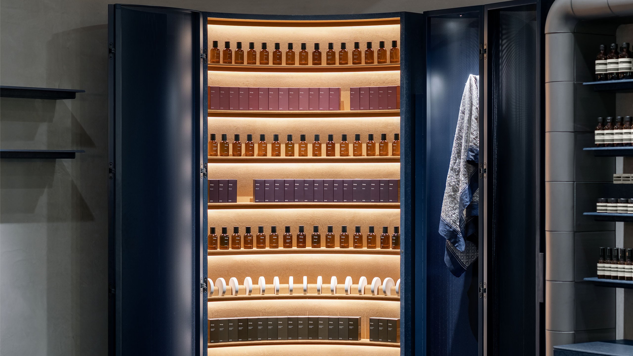 Aesop Kobe BAL store view, the shelf for products, lights are coming from behind