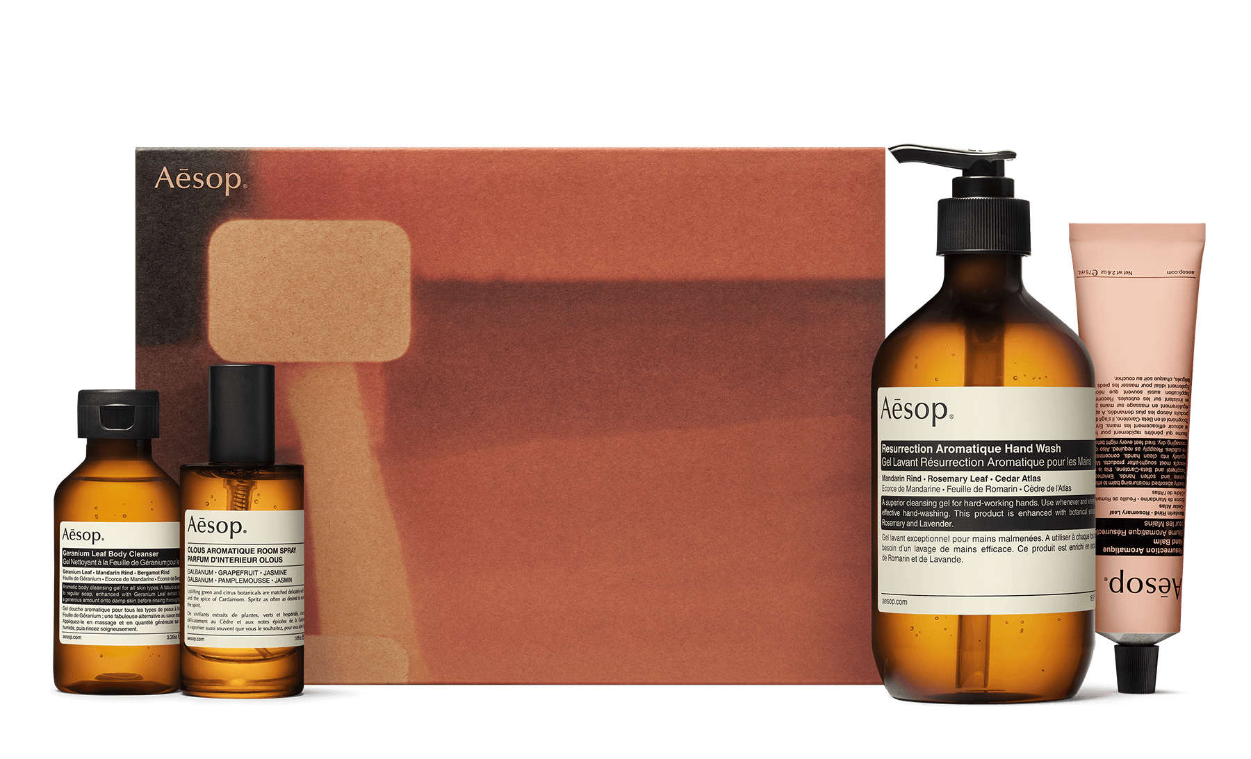 orange abstract patterned box with four Aesop products in the foreground
