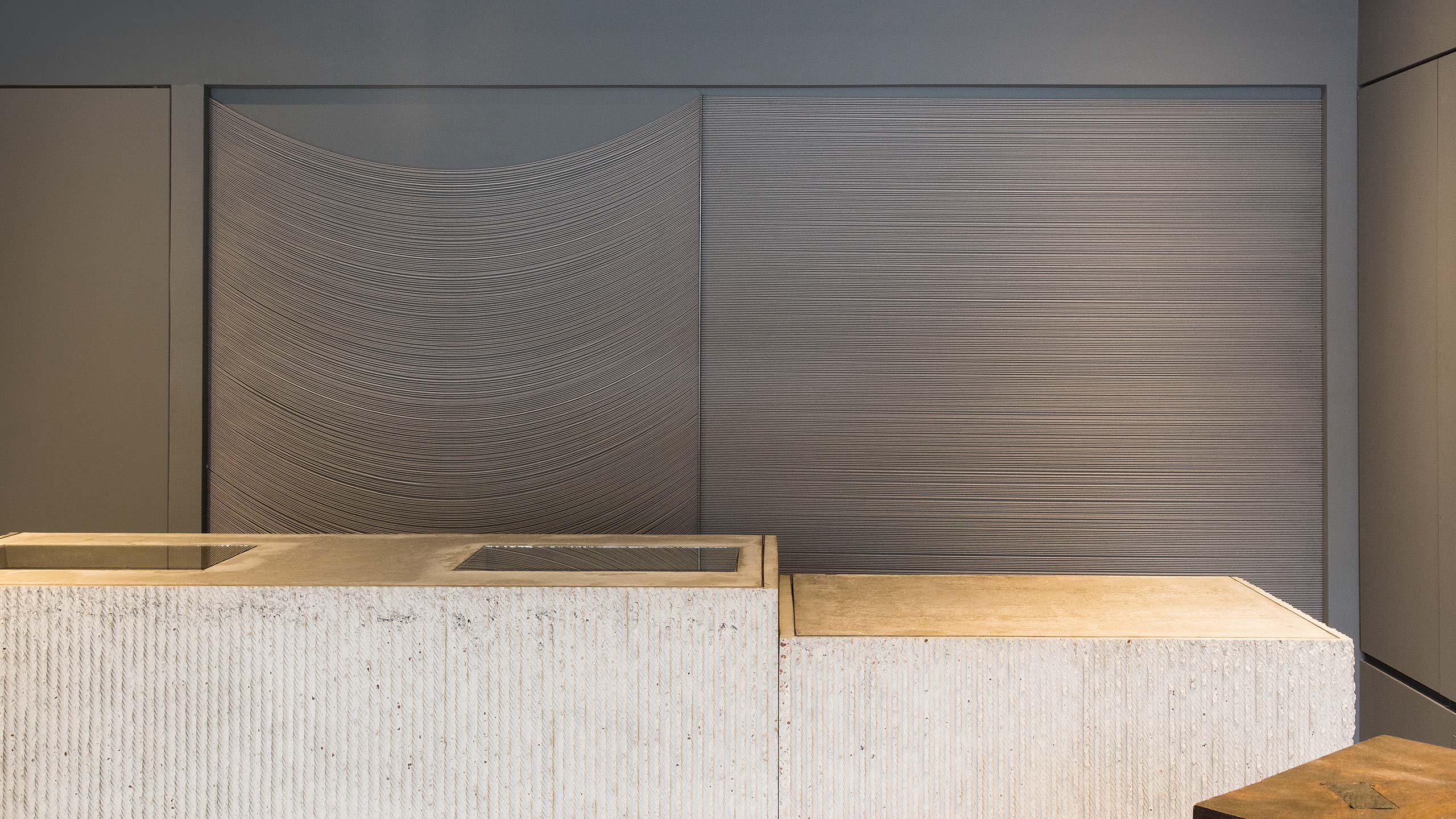 Stone store counter with a steel backdrop