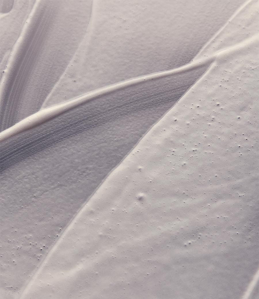 Close-up of Eleos Nourish Body Cleanser cream texture.