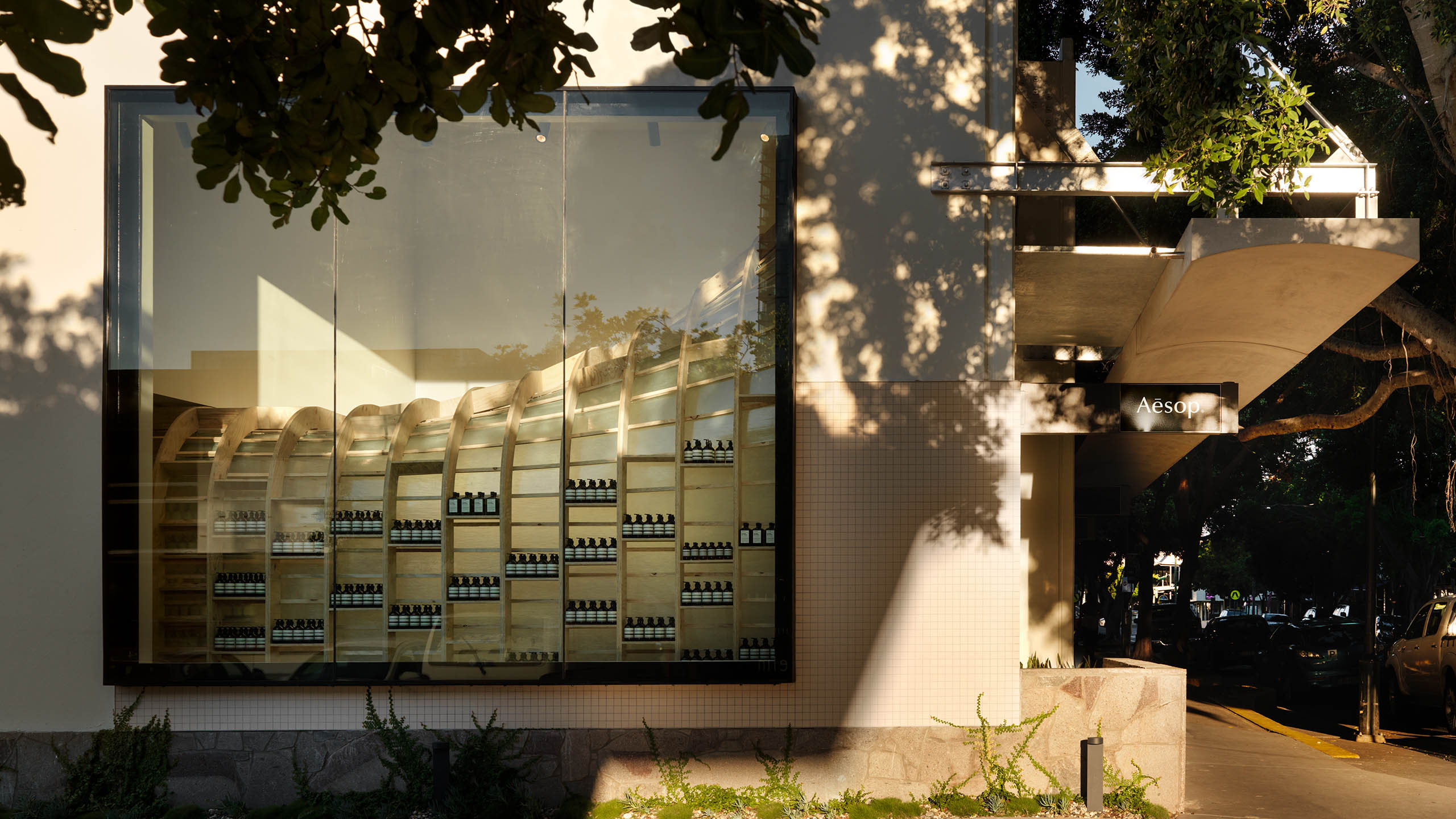 An exterior view of the James Street store window, displaying the unique curved interior.