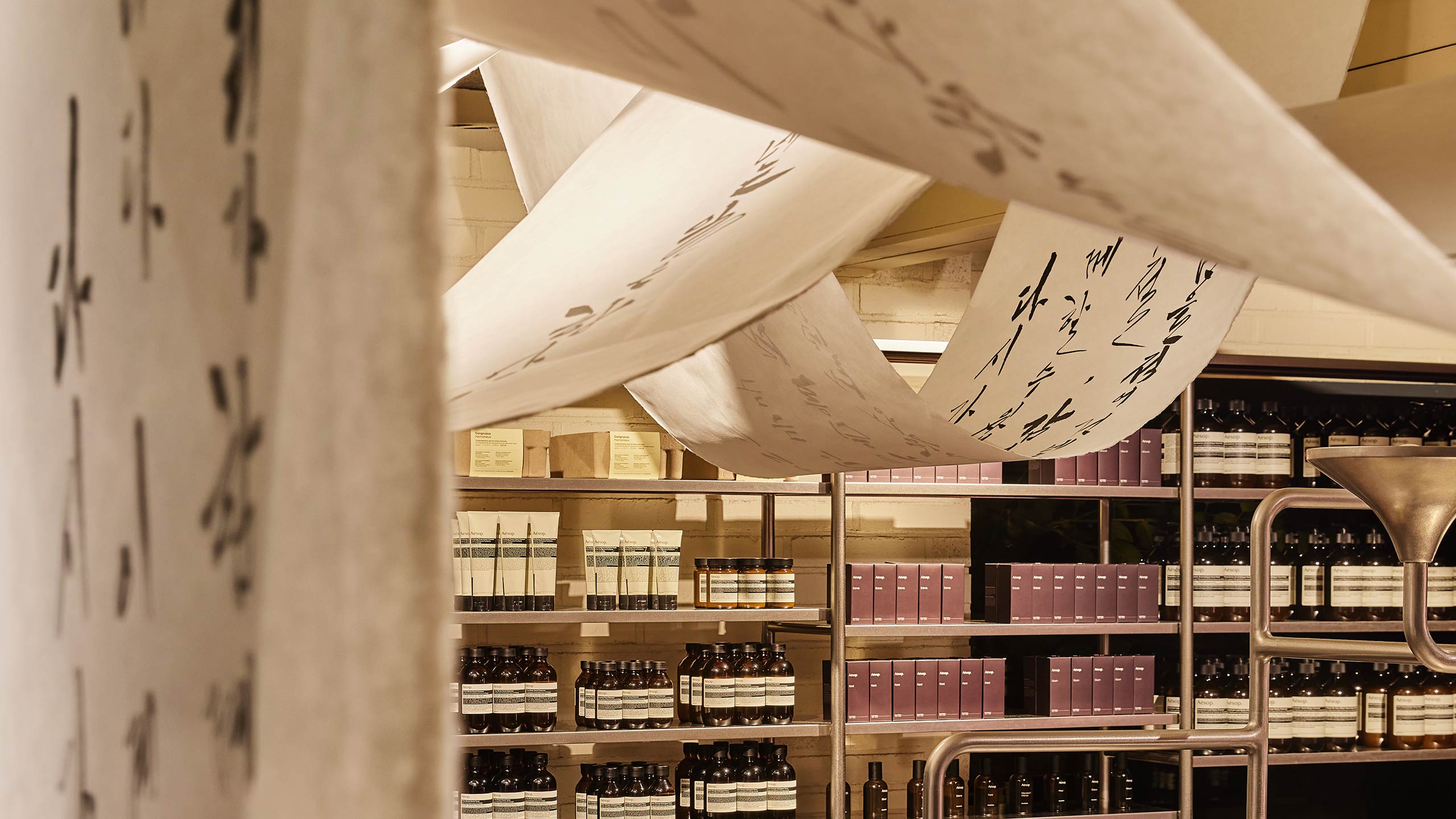 Calligraphy installed on inside of Aesop store