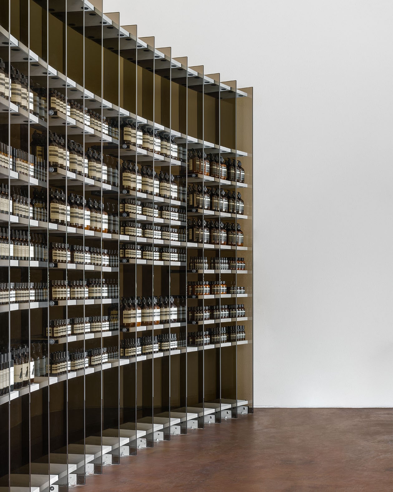 Close up of shelving unit of smoked glass.