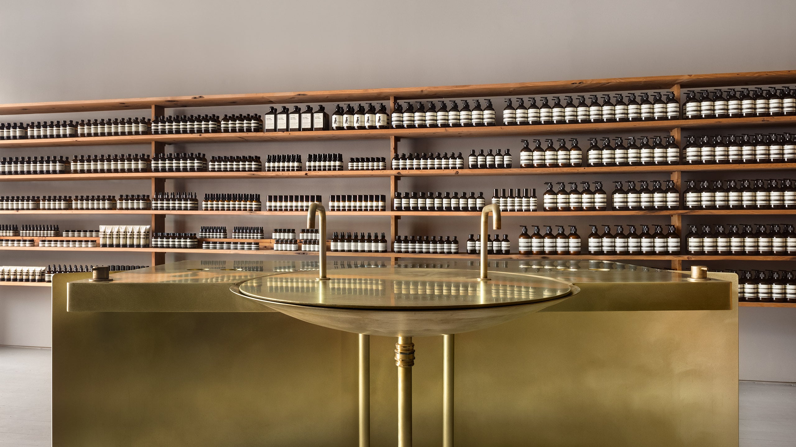 Aesop Greenwich Connecticut Store Interior featuring golden basin and benchtop
