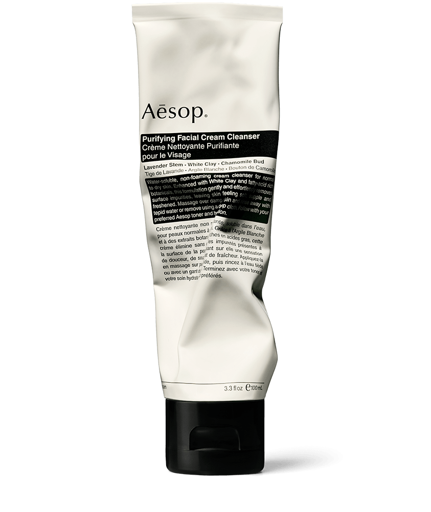 Purifying Facial Cream Cleanser de Aesop en tubo de aluminio; enriquecido con tallo de lavanda y arcilla blanca.