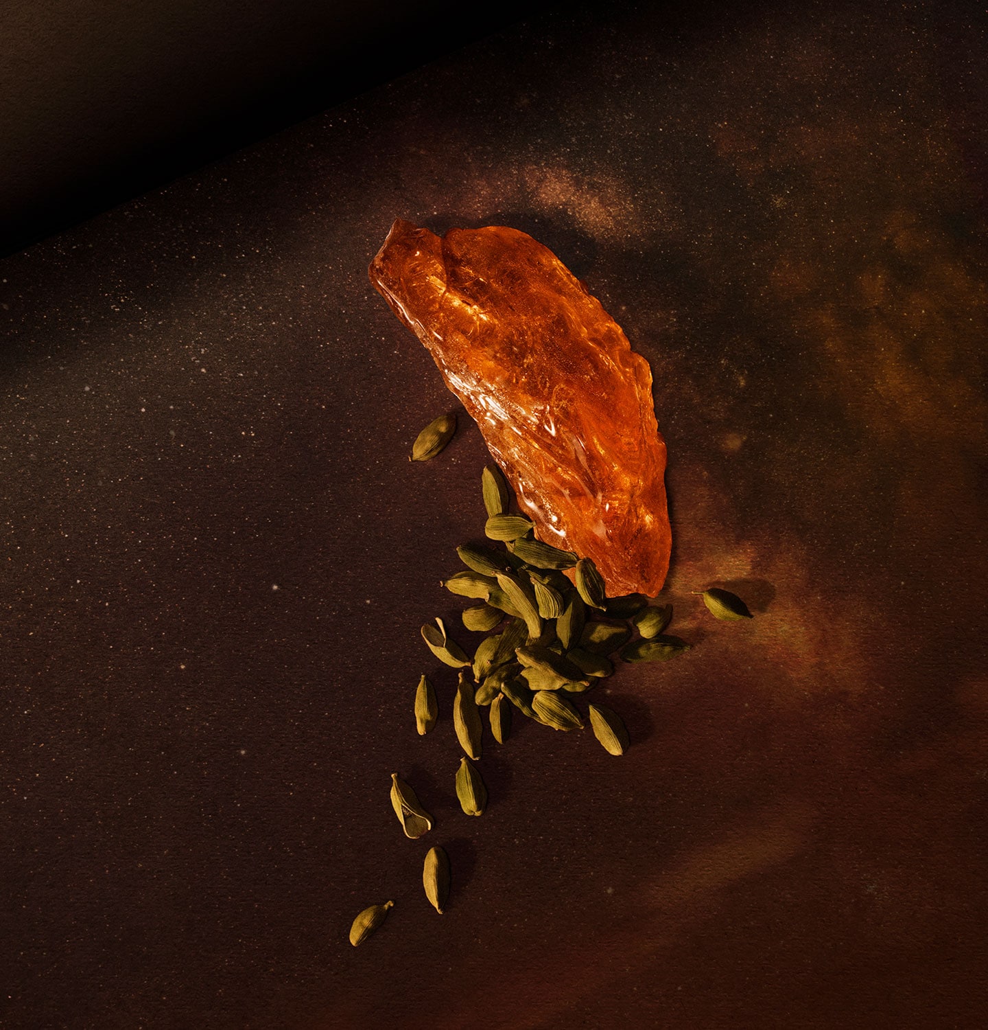 amber and cardamom placed on top of amber background