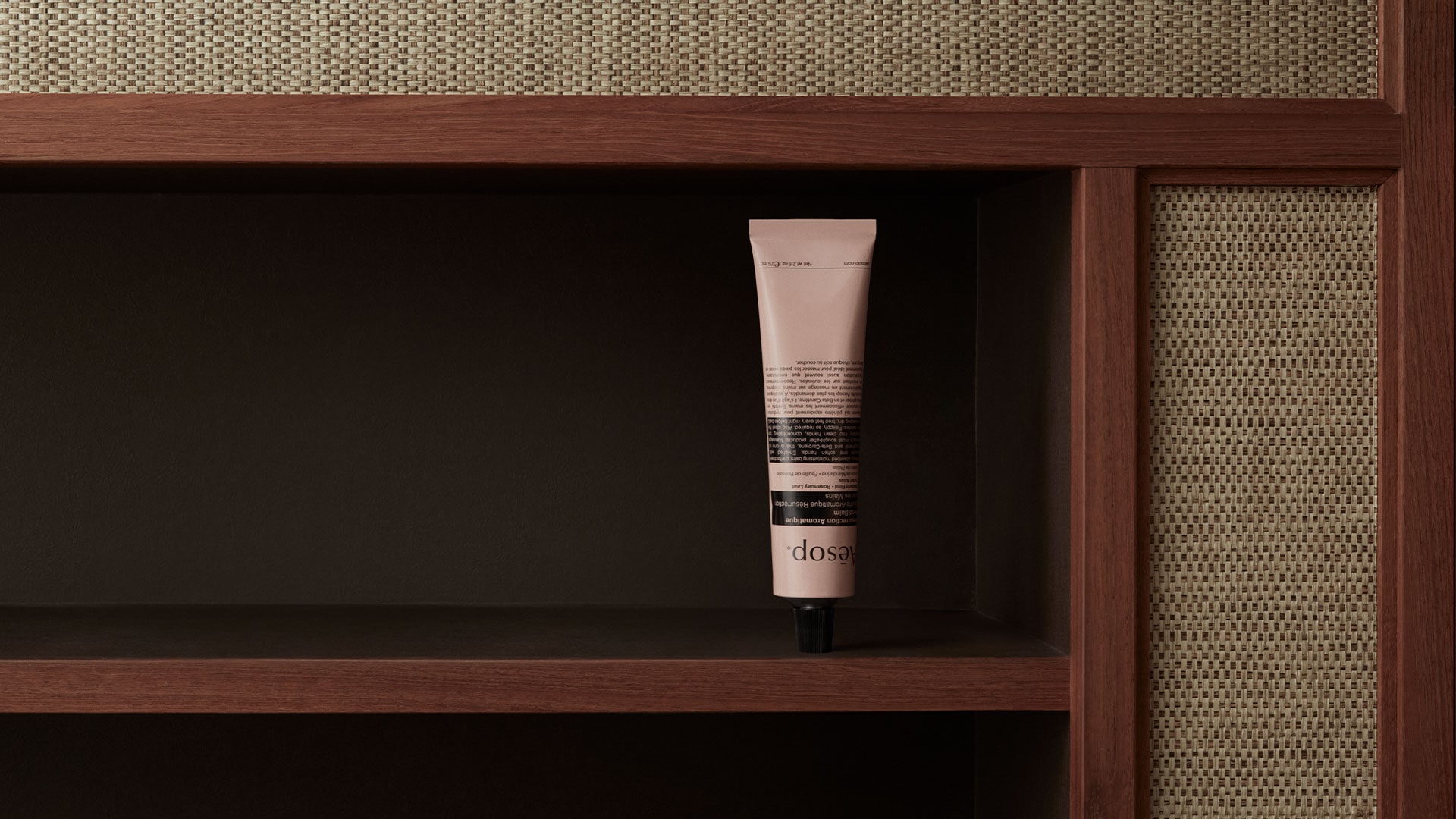 Resurrection hand balm in tube placed on a wooden shelf