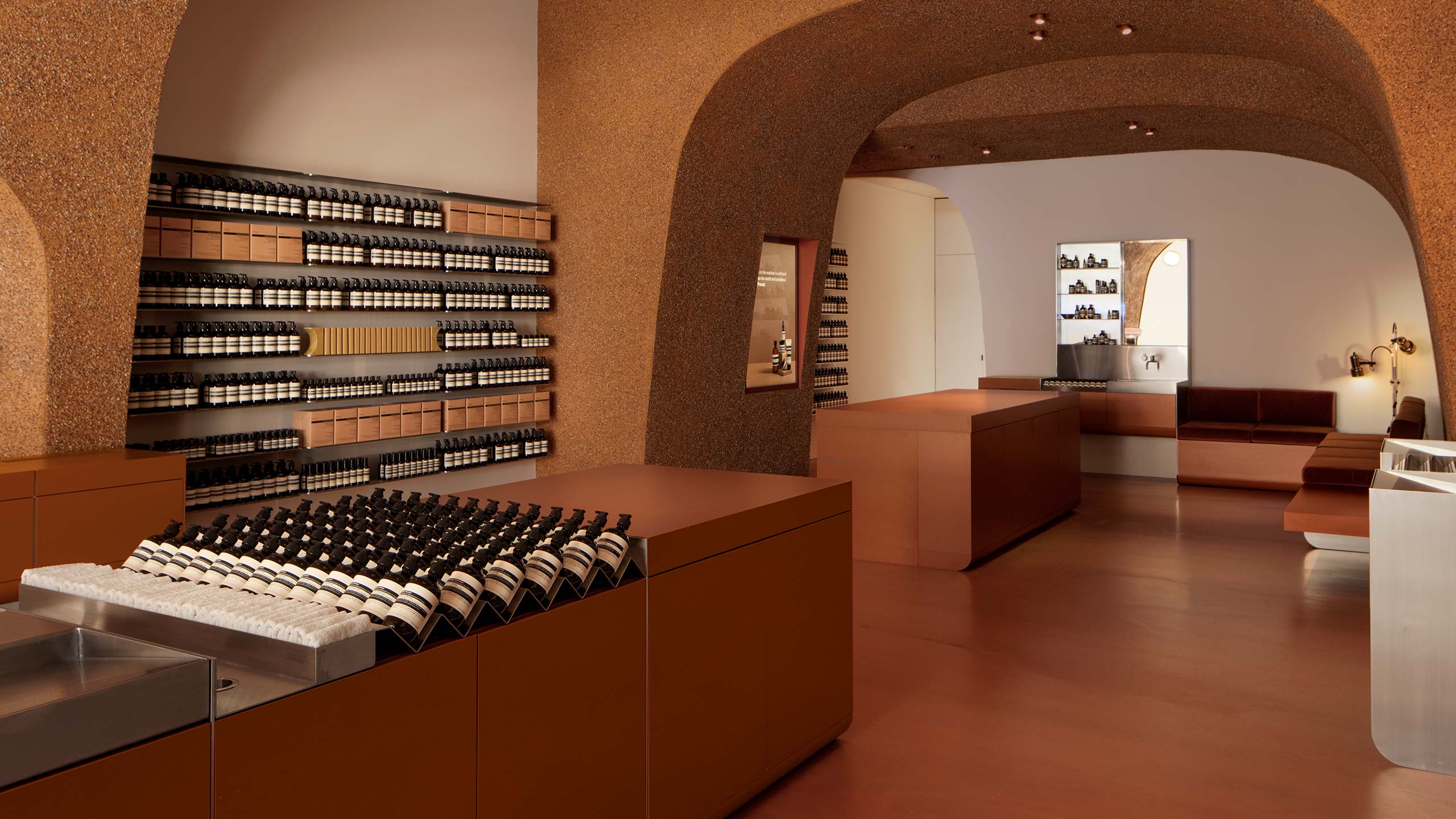 Aesop Southland interior showing Aesop product placed on shelves and benchtop next to a sink
