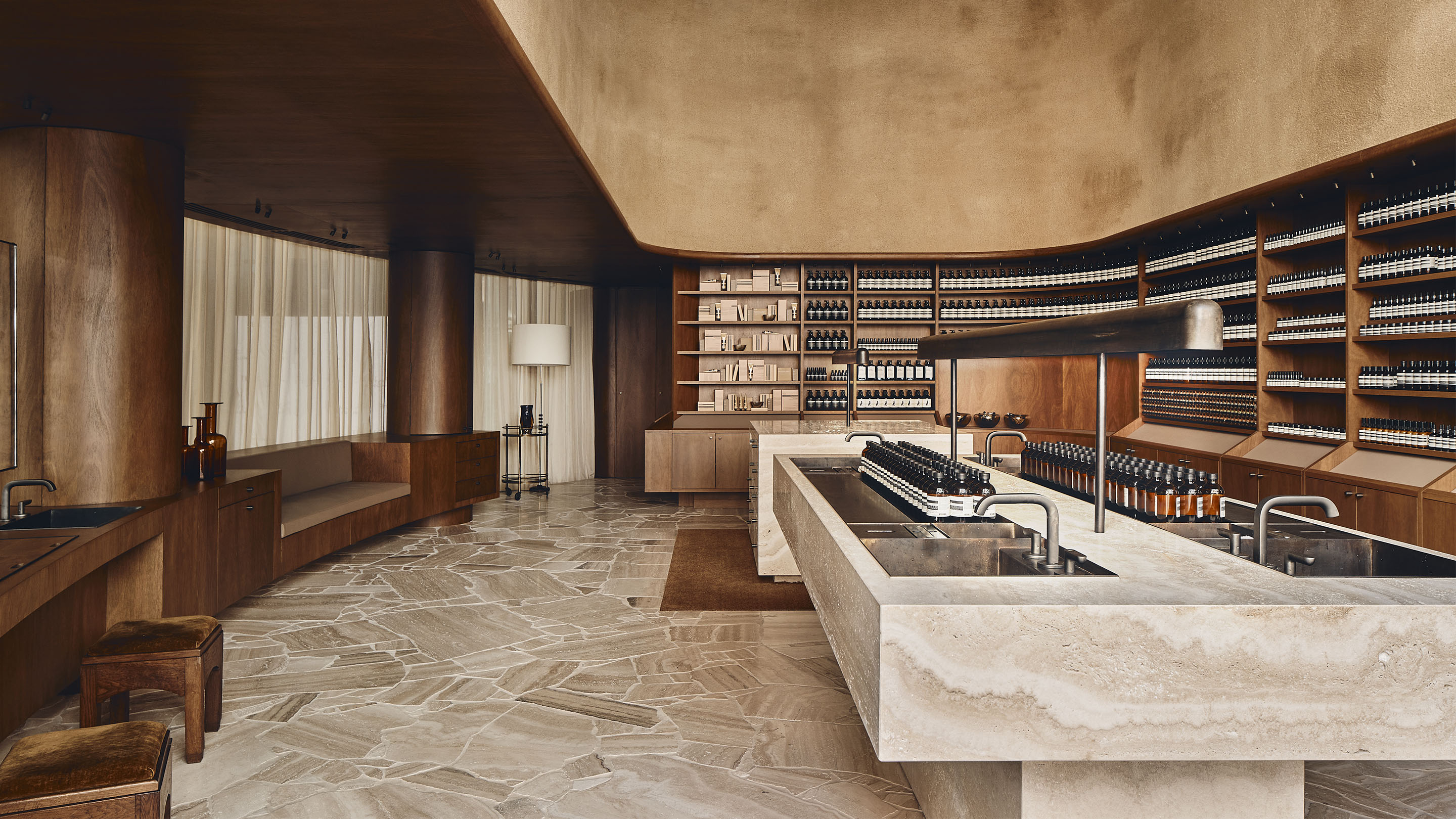 The store interior featuring travertine off-cut terrazzo floors accompanied by wooden interior walls