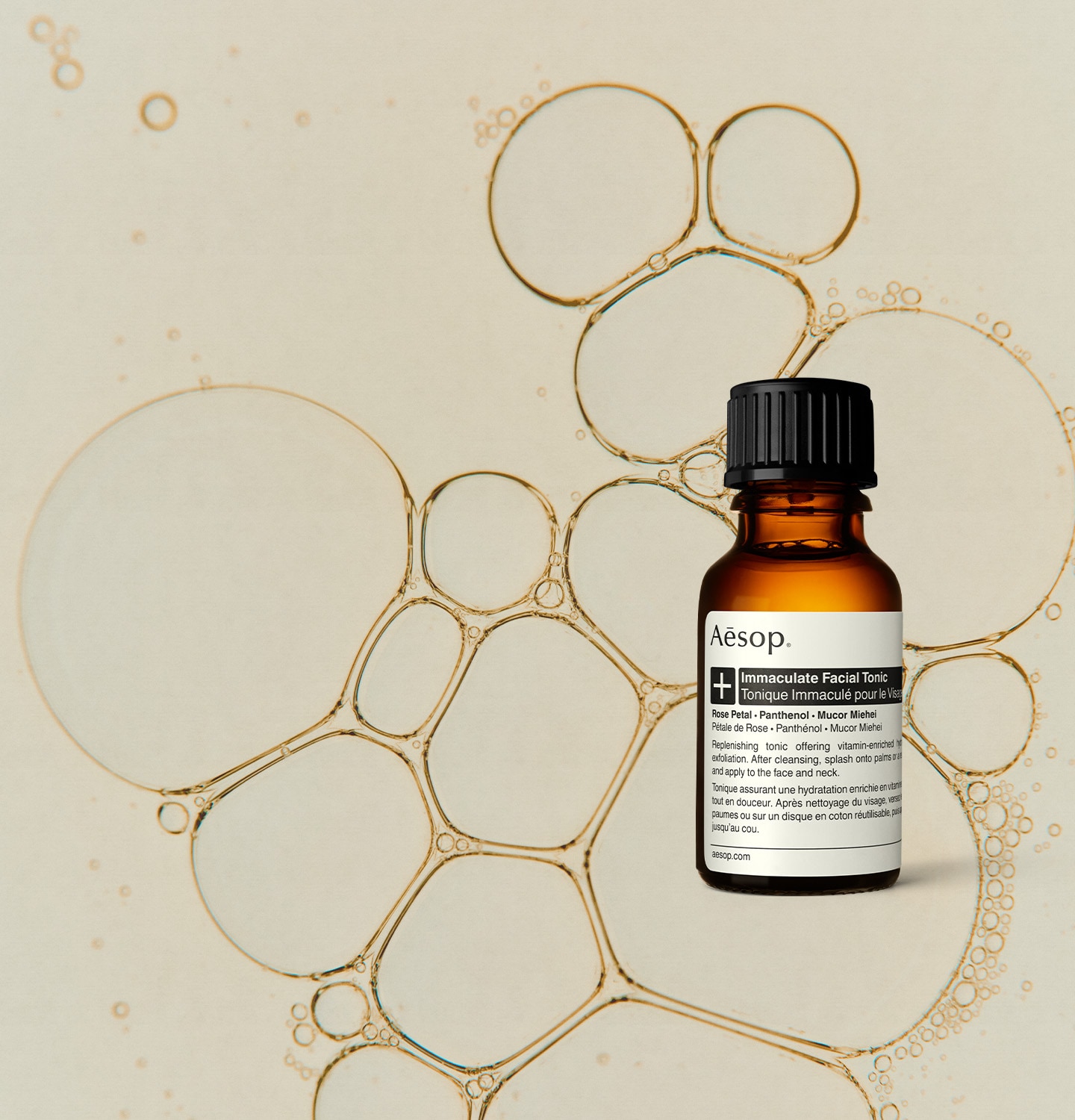 A sample of Immaculate Facial Toner on an abstract close-up background of liquid droplets of various sizes