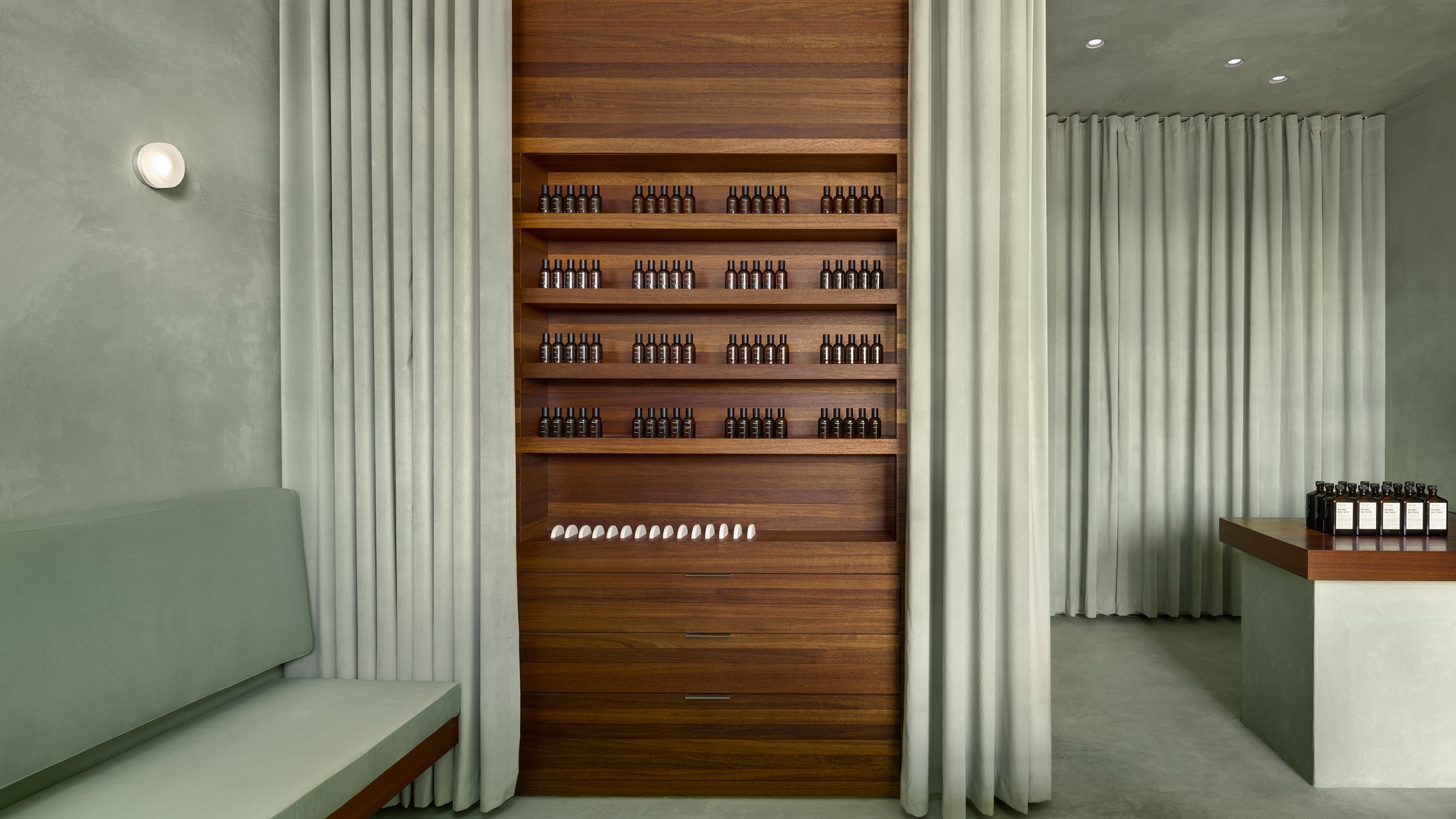store shelves lined with Aesop product bottles