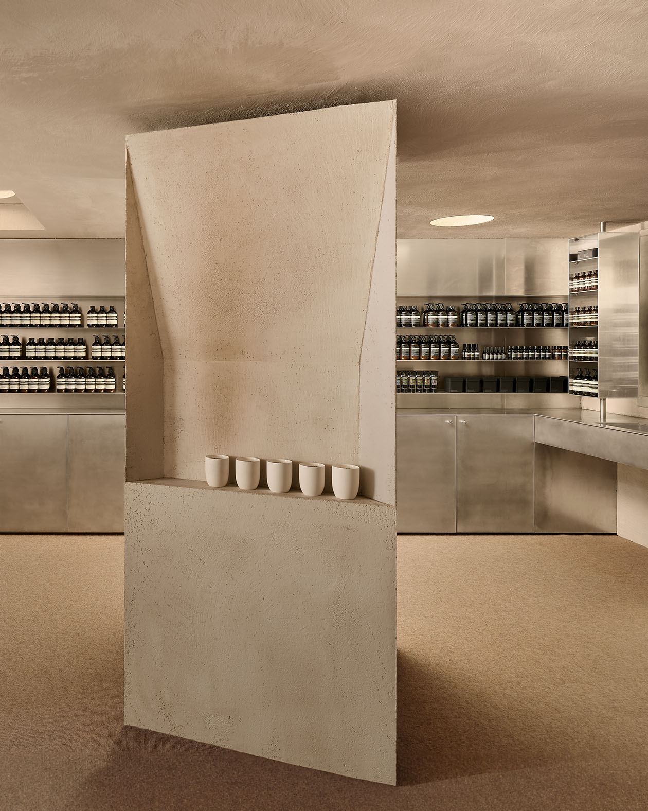 store interior featuring cement floor to ceiling column with a single shelf