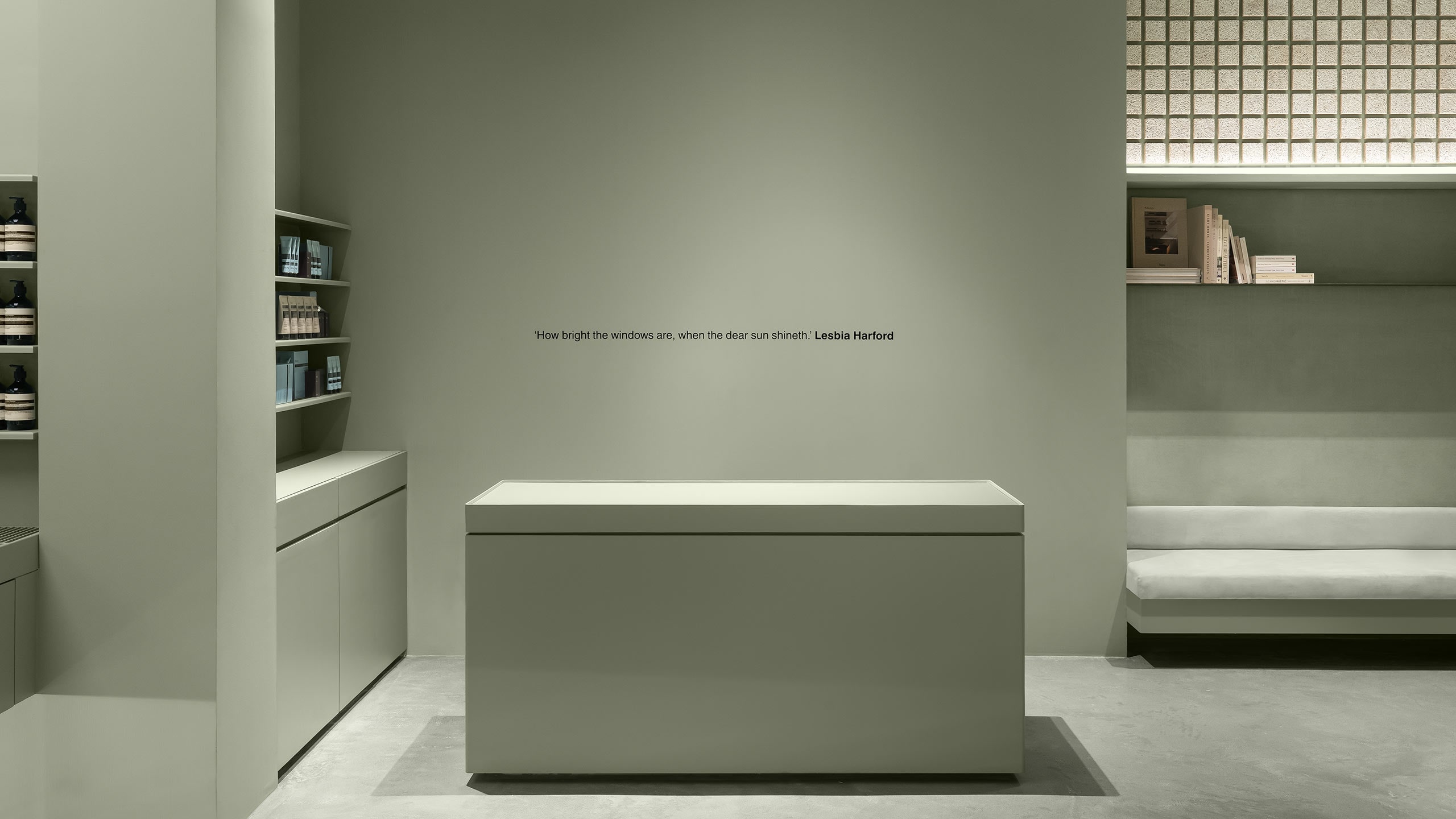 gray wall with the quote stands out behind of a cash register