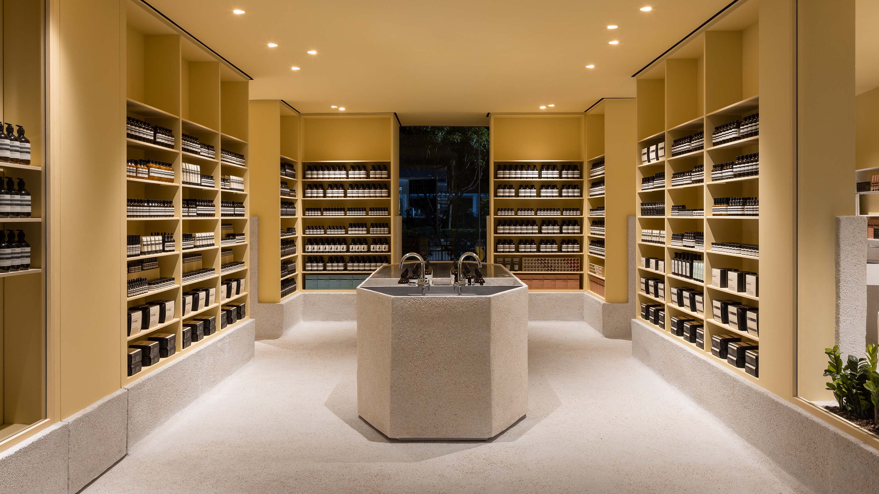 Aesop Tampines store with beige walls displaying Aesop products