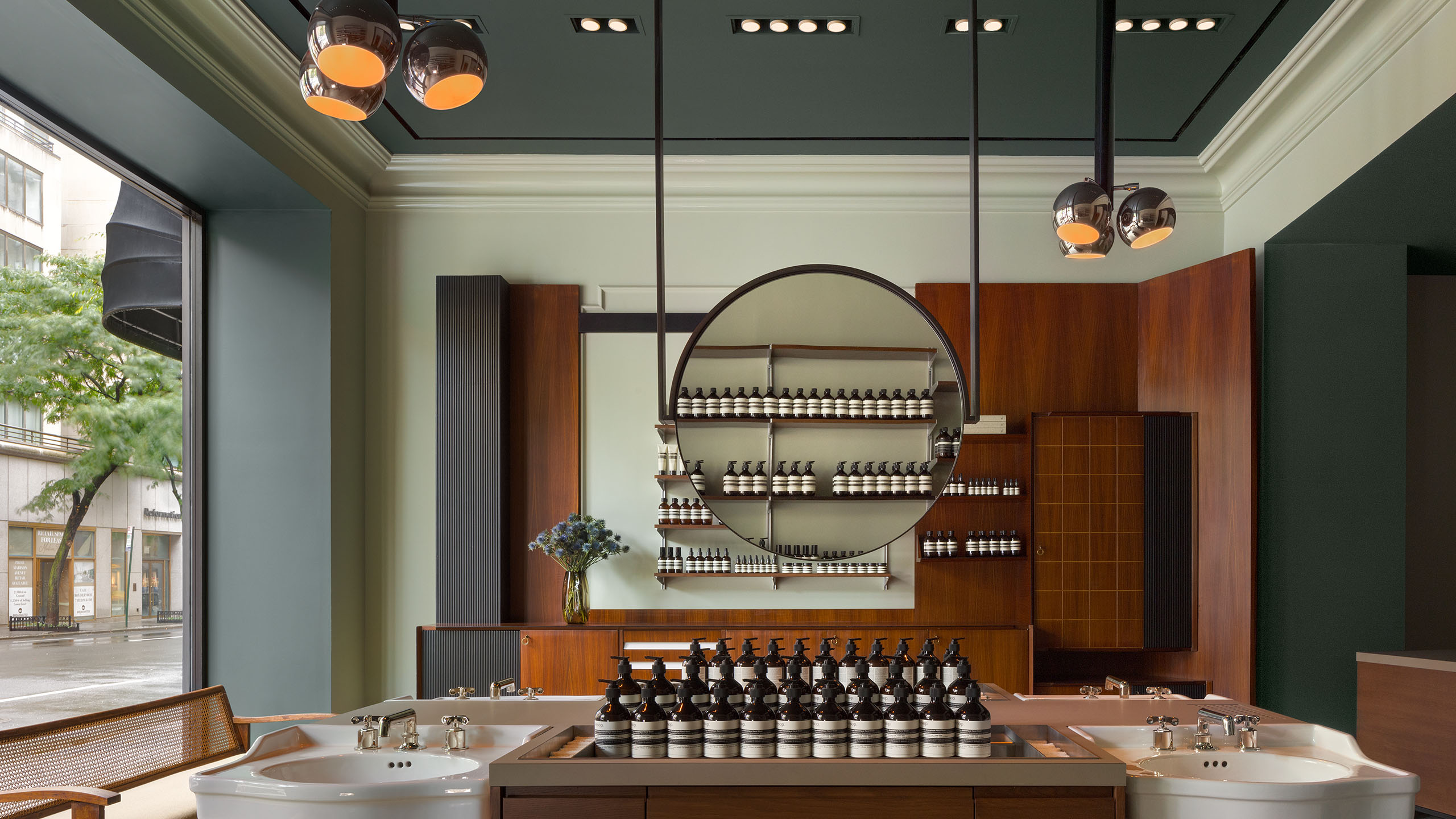 Aesop Madison Avenue store interior featuring basins and mirror