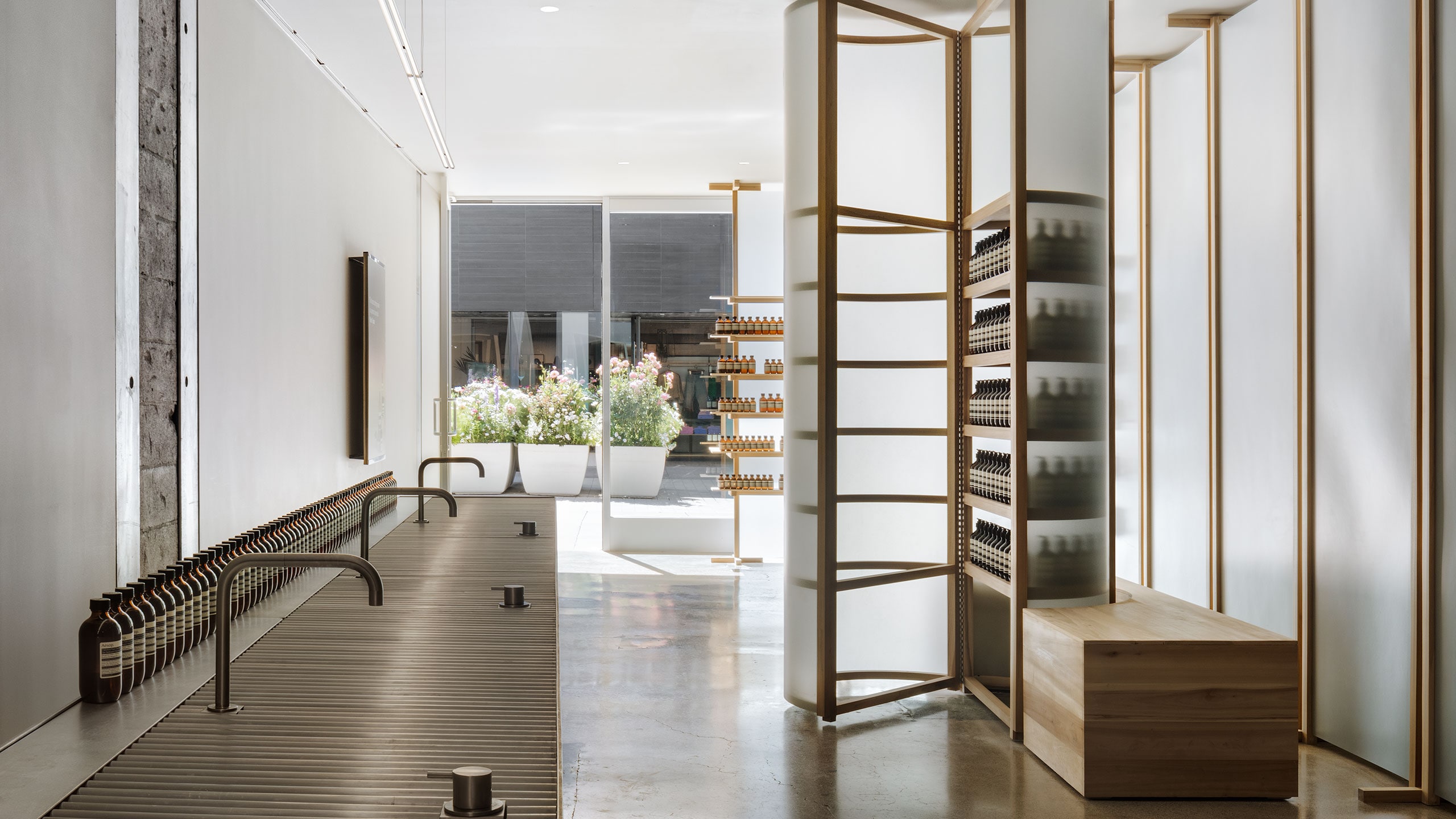 Interior of steel sinks contrasted with fibre-glass shelves looking out on