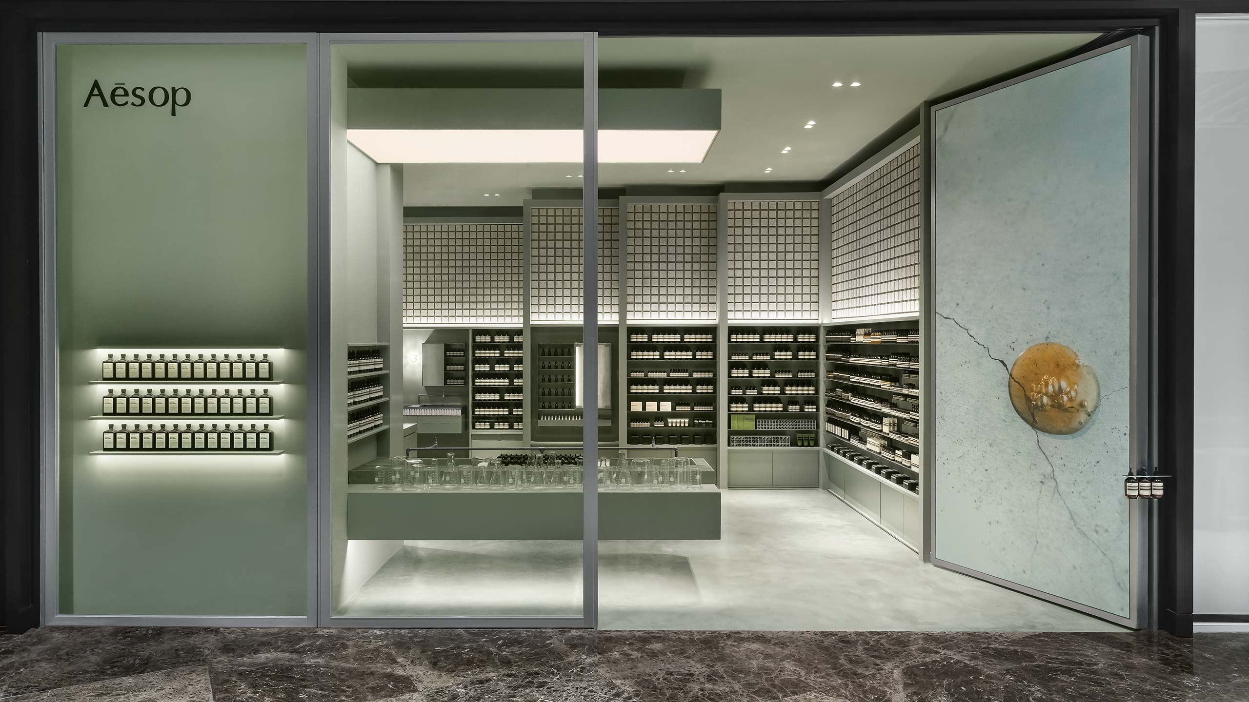 Aesop store photo with warm green atmosphere