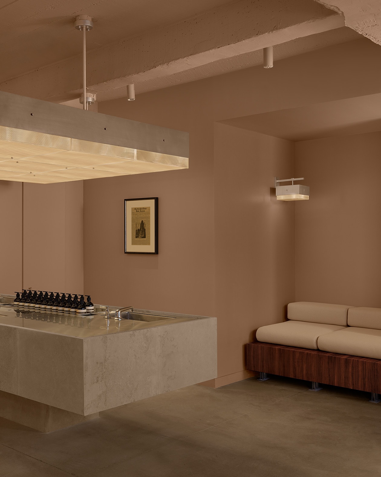 beige store interior featuring large granite basin and couch seating area