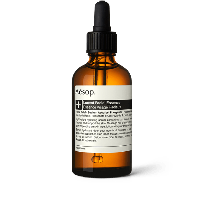 Lucent Facial Concentrate in an amber glass bottle with a pipette. 