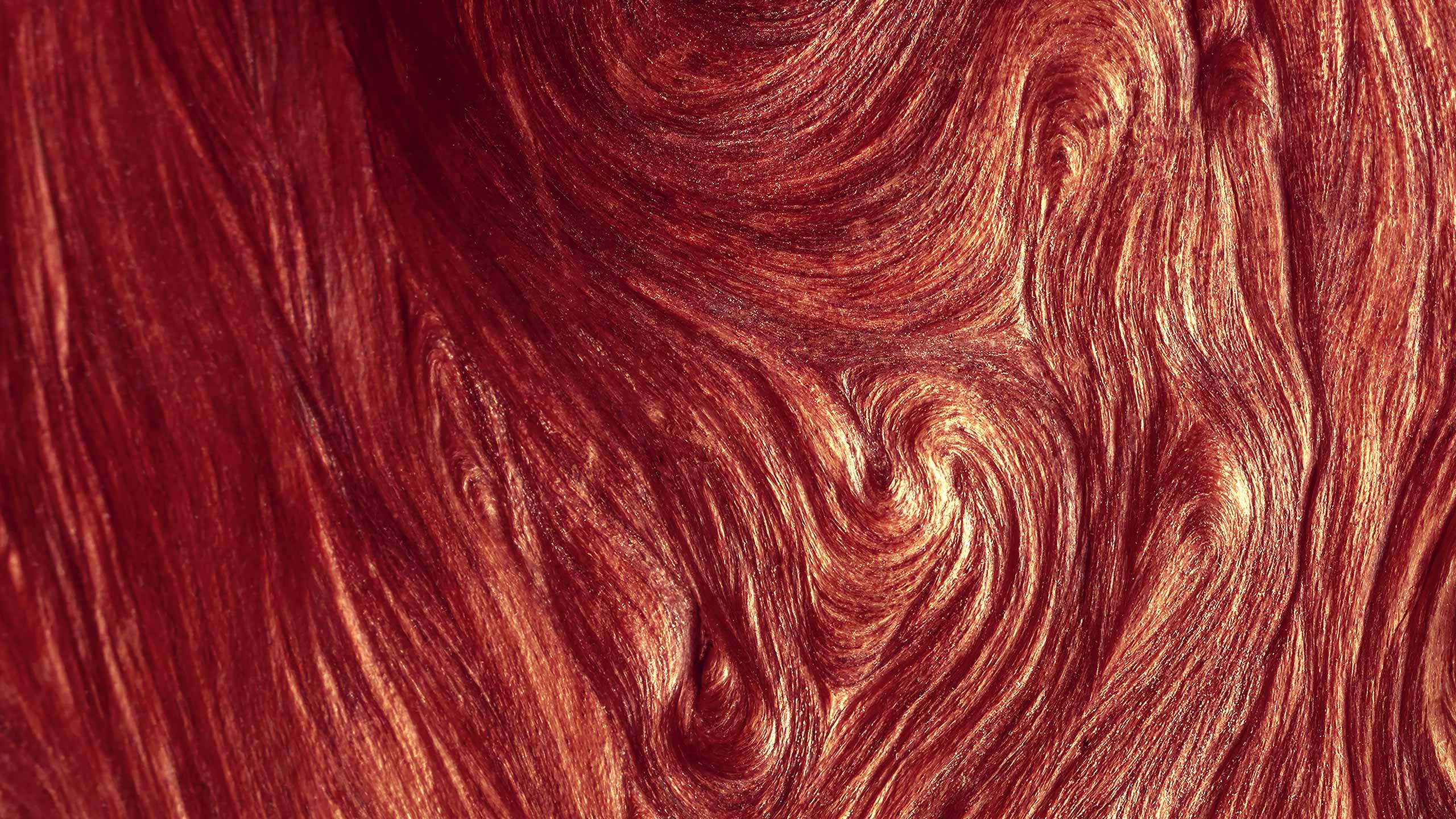 A swirling red texture.