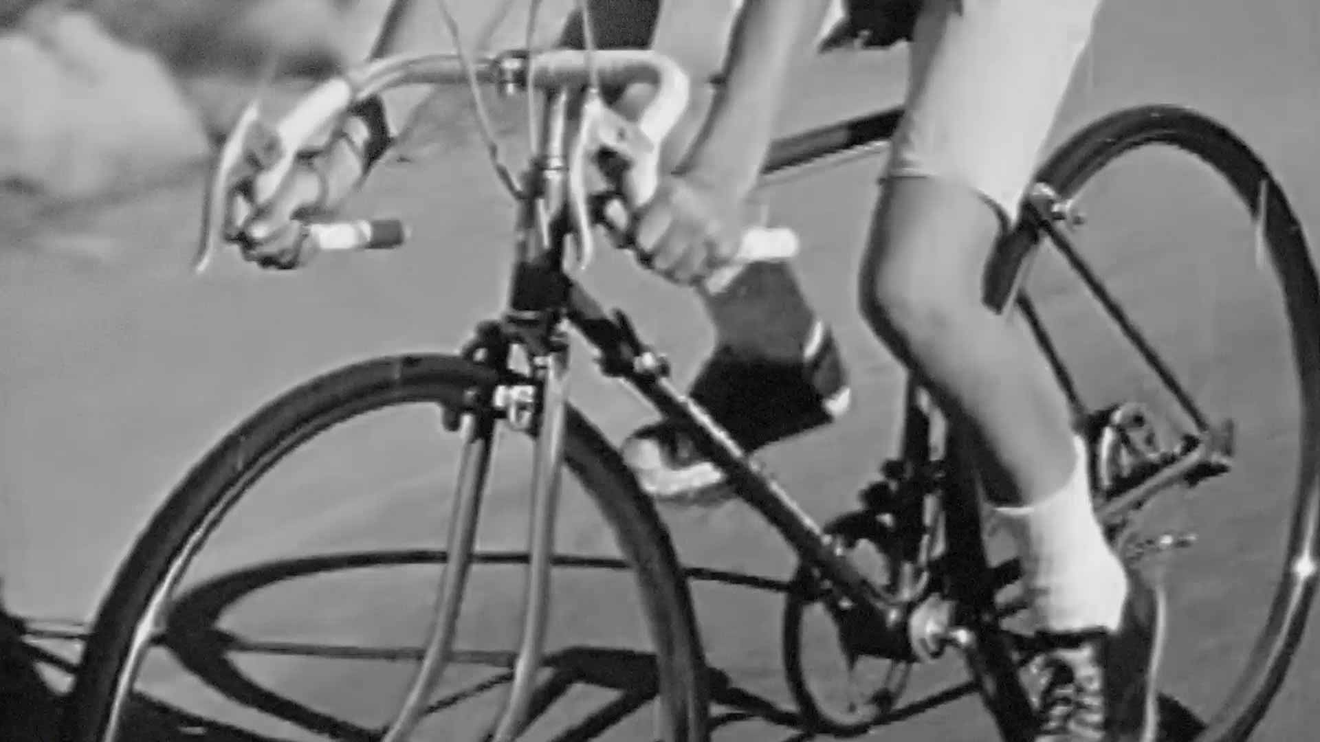 Retro, black and white footage of a bicycle.