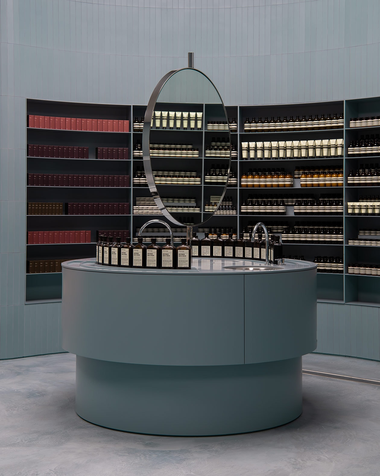 Aesop Karrinyup interior, featuring round blue basin with circular mirror.