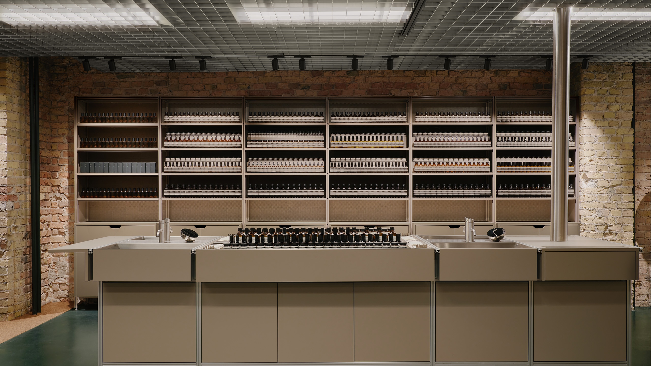 Aesop Kurfurstendamm store interior worktop and product displaying amber bottles