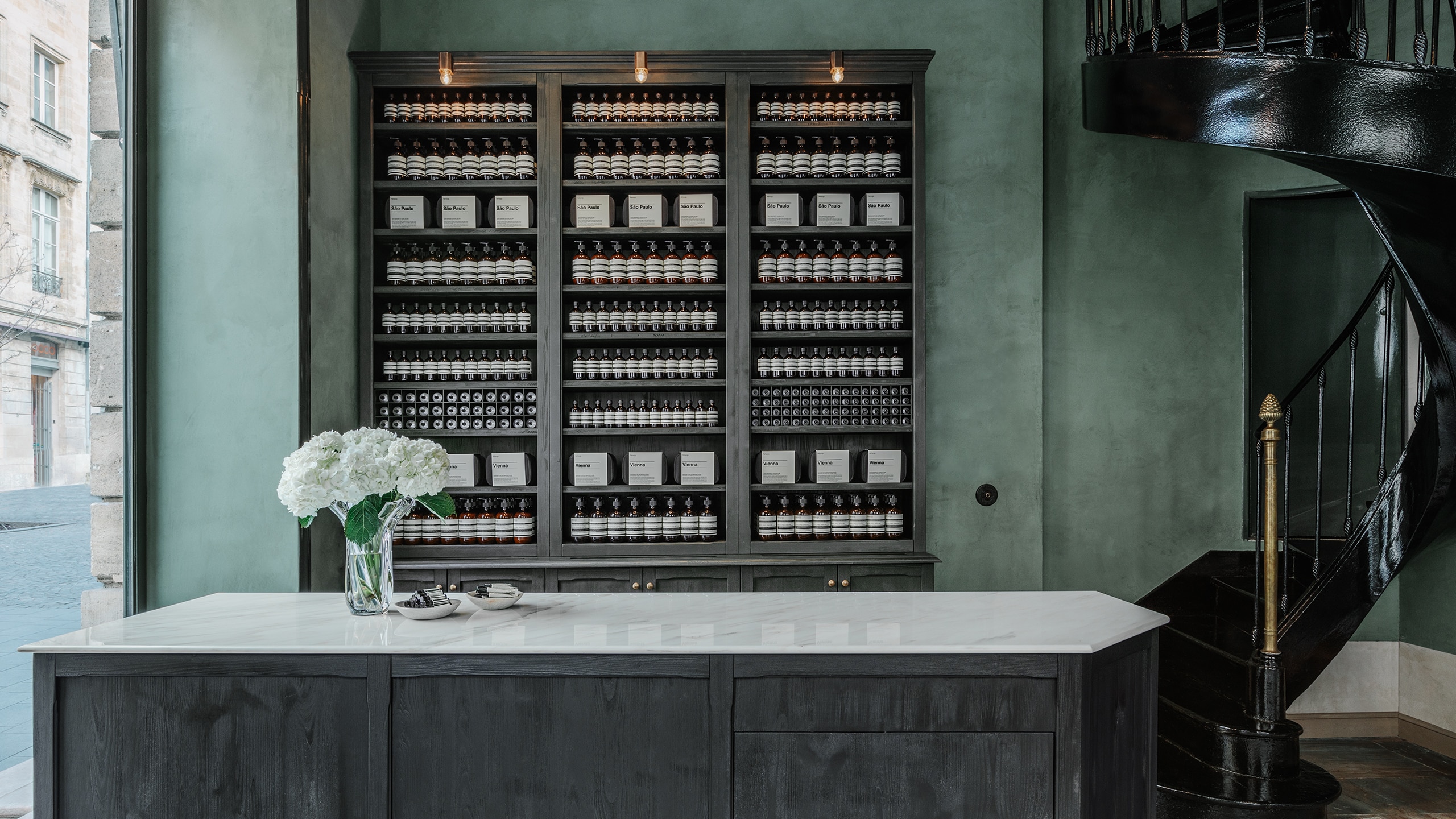 Aesop Bordeaux store interior surface and product displayed within cabinet