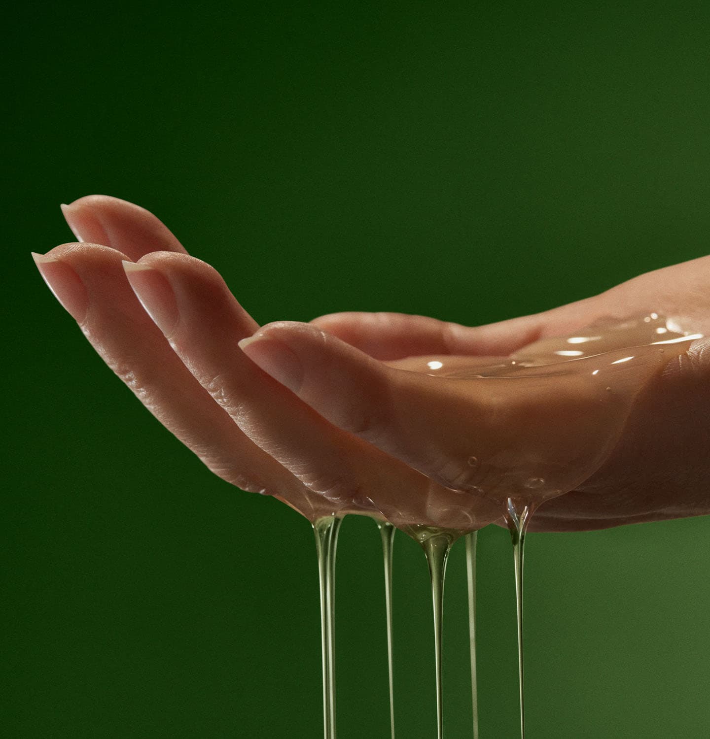 A hand demonstrating the texture of Geranium Leaf Body Cleanser